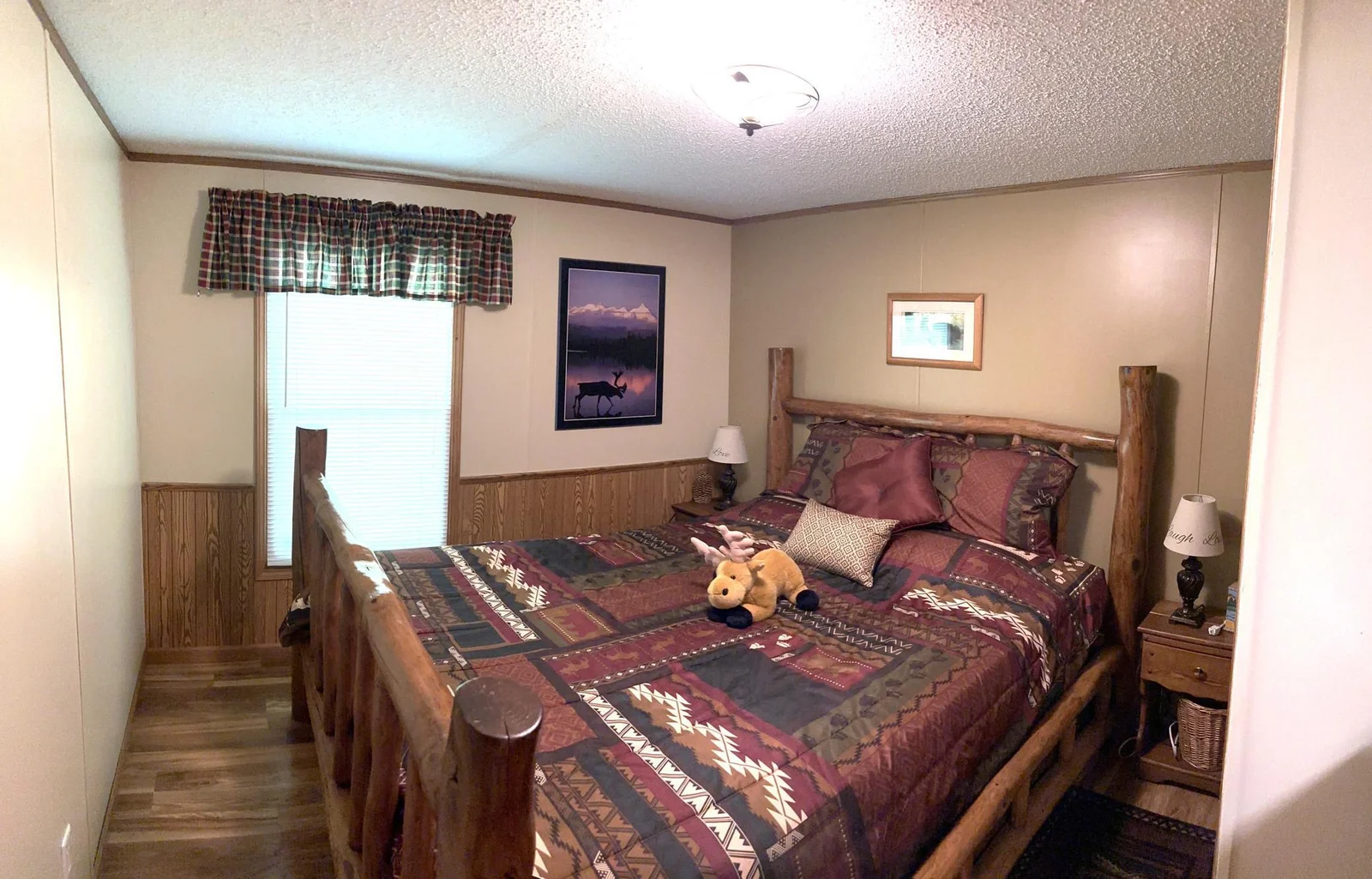 Bedroom 2 with a solid log bedframe