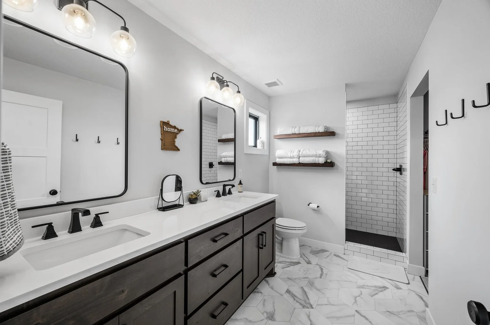 Primary bathroom features double sinks and upgraded tile shower!