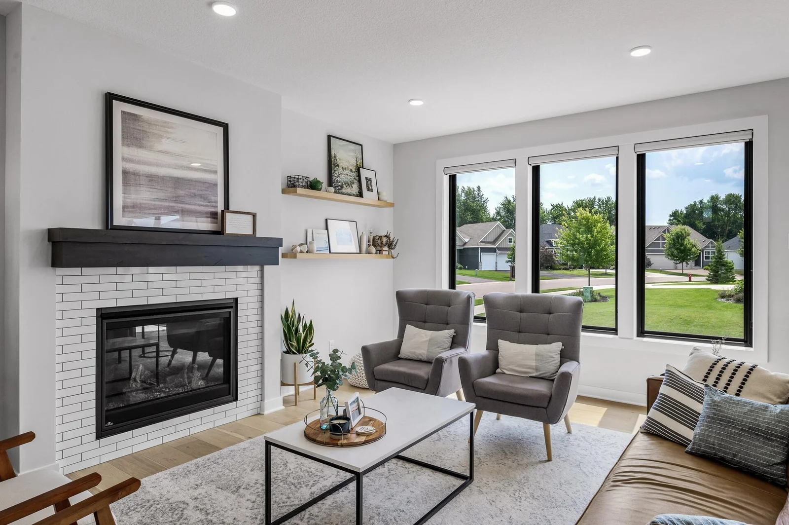 Oversized windows bring in a ton of natural light, custom shades for when you dont need it! Gas fireplace for those long Minnesota winters.