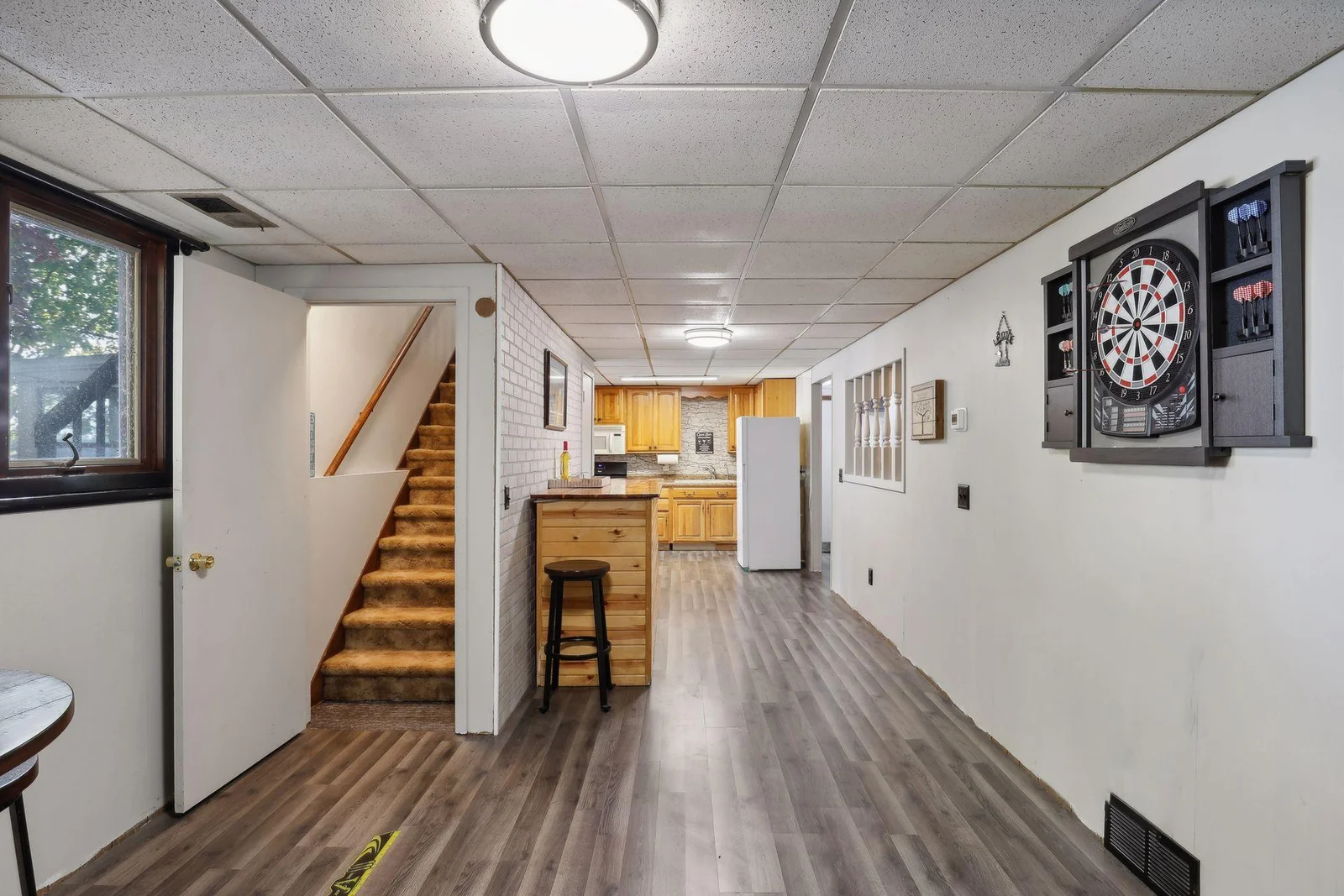 Stairs up to upper level,Nice space. Selers have a bar /you could add dining space here