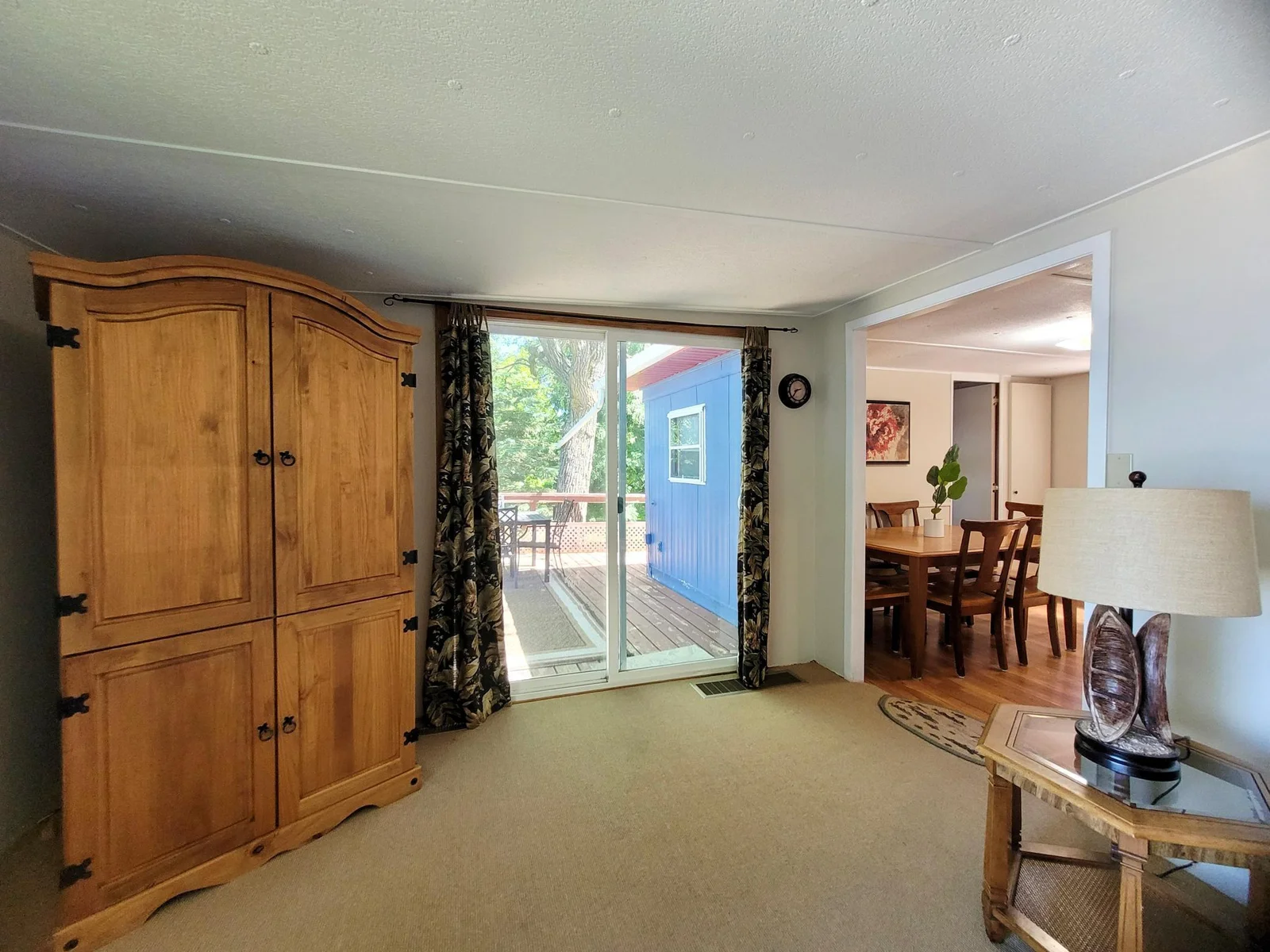 Living Room Connected to Dining Room and Deck
