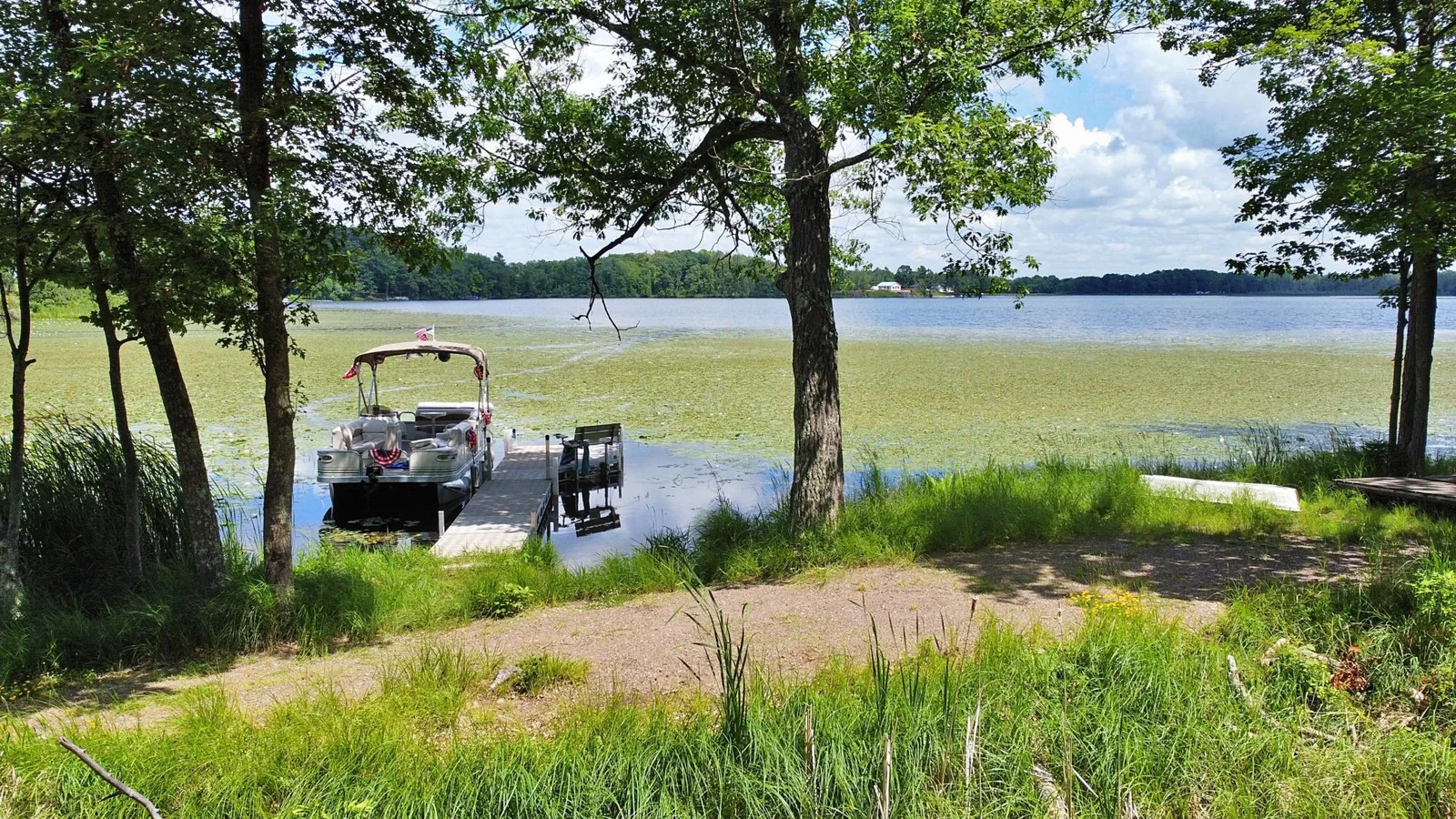 Dock location along shoreline (dock and boat not included in Sale)