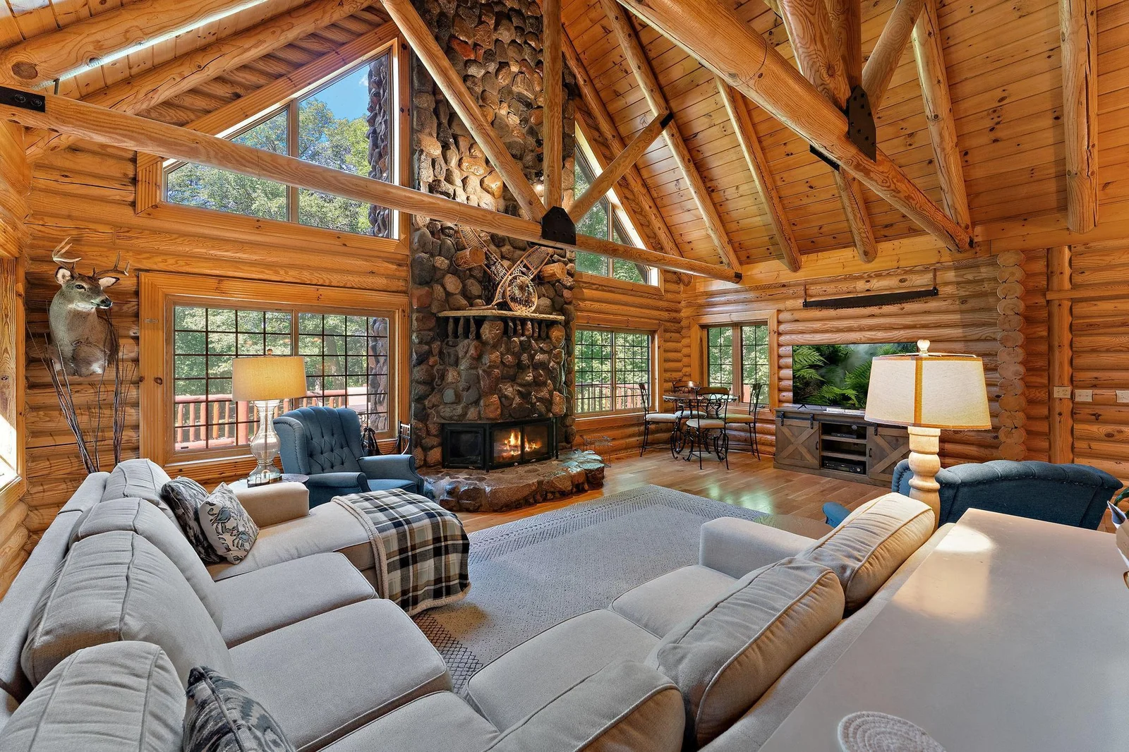 Beautiful Great room shows the lovely log and crossbeam construction