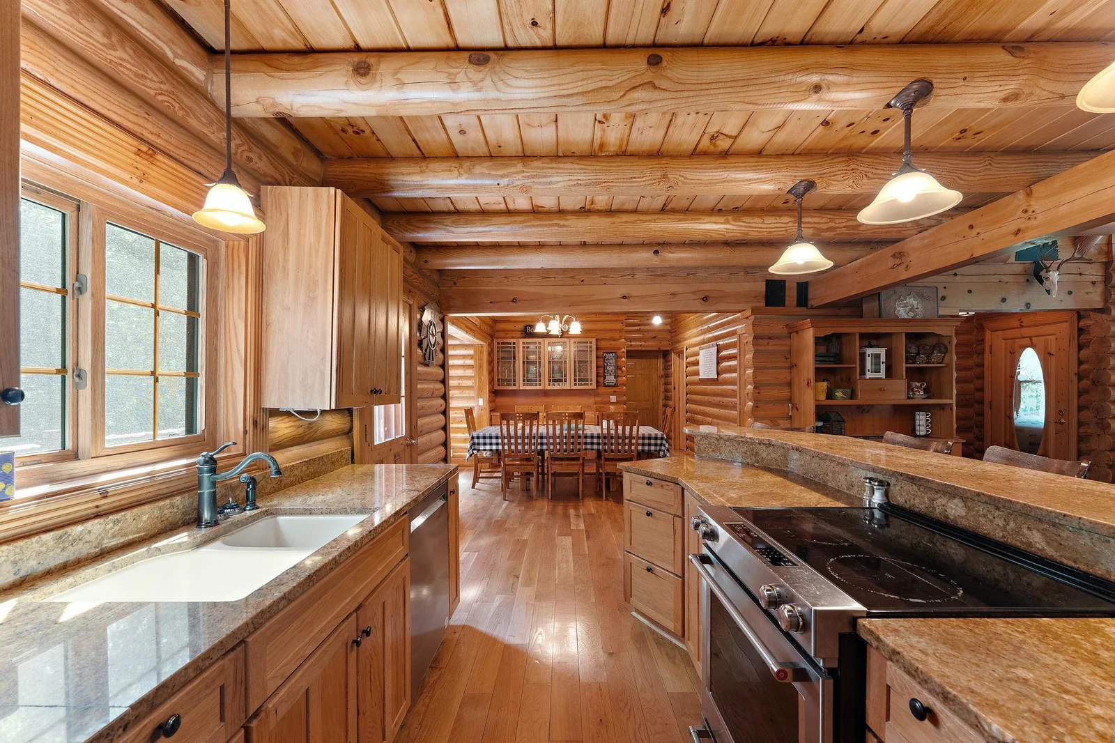 Gorgeous kitchen and dining space!  Separate dining room is located just off the kitchen, complete with a glass, built-in serving buffet or hutch area.