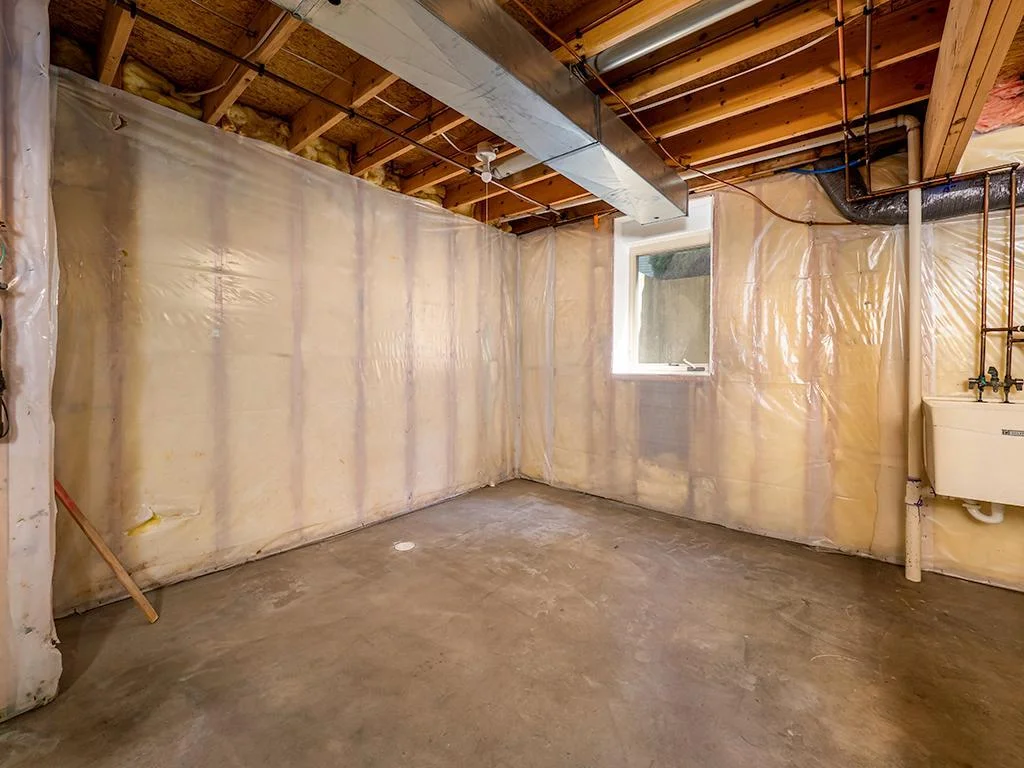 Basement with egress window for future fourth bedroom.jpg