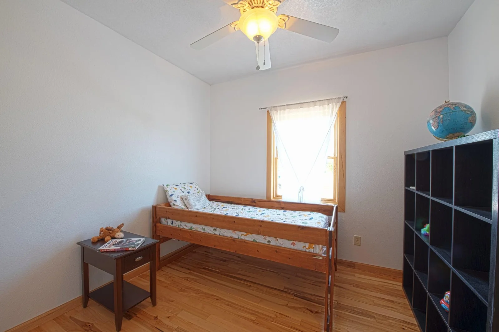 One of the two bedrooms that share a bath.