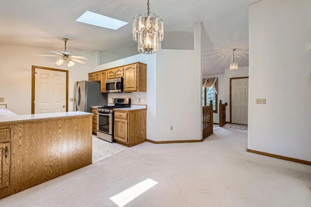 View from the Dining area to the front door and Living Room.