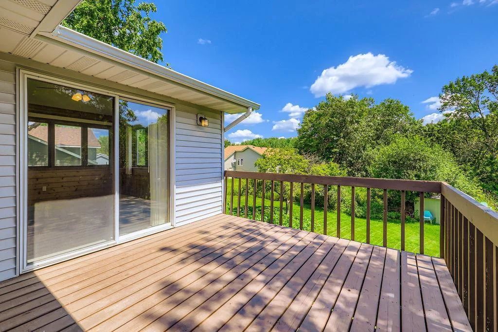 Walk out to the deck and look at that backyard!