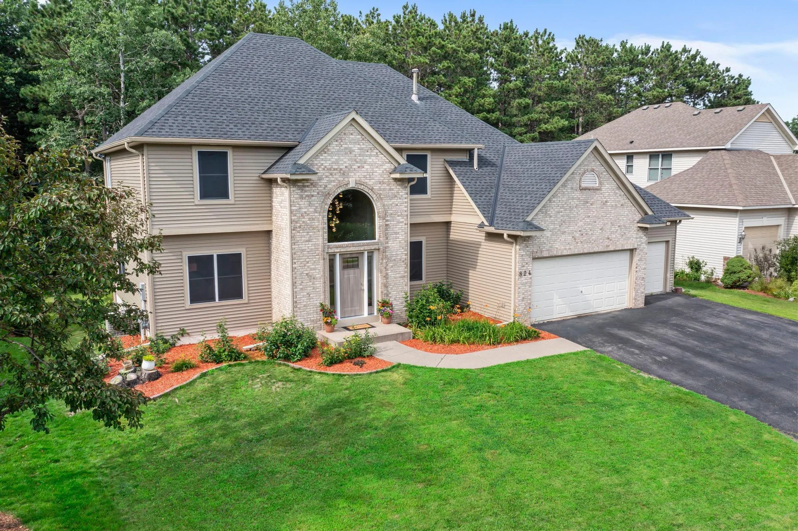 Front exterior offers beautiful curb appeal with lovely landscaping