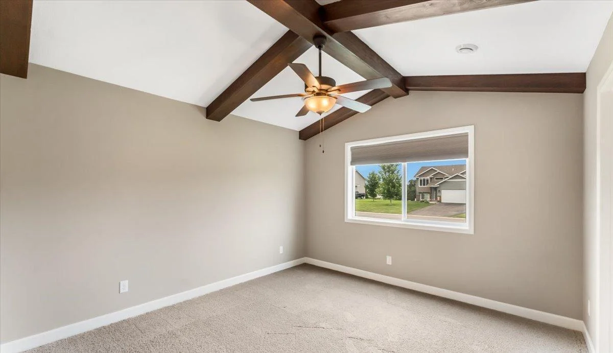 Restful, refined, and roomy primary bedroom.