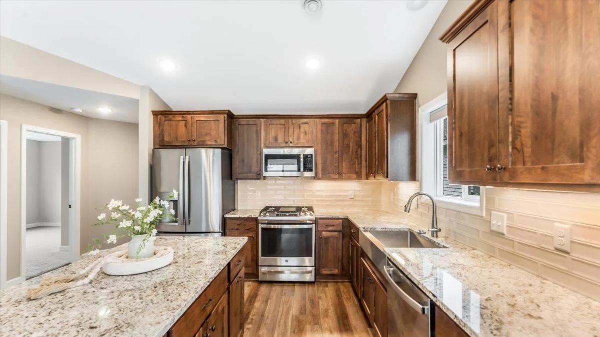 Stainless steel appliances and granite counter tops.