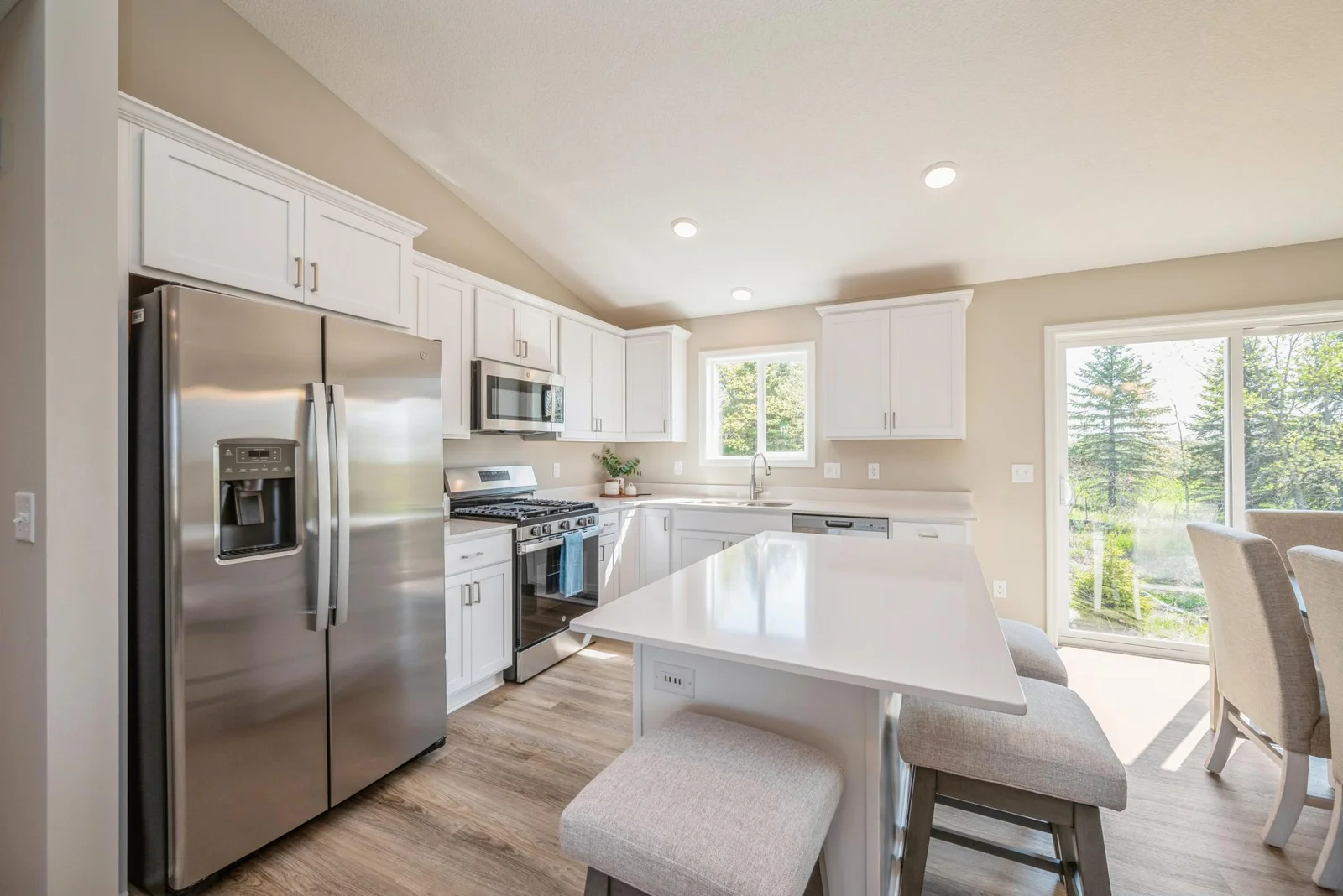 Kitchen View. Photo is of former model home. See Sales Consultant for Specific Colors and Options. Ability to choose!