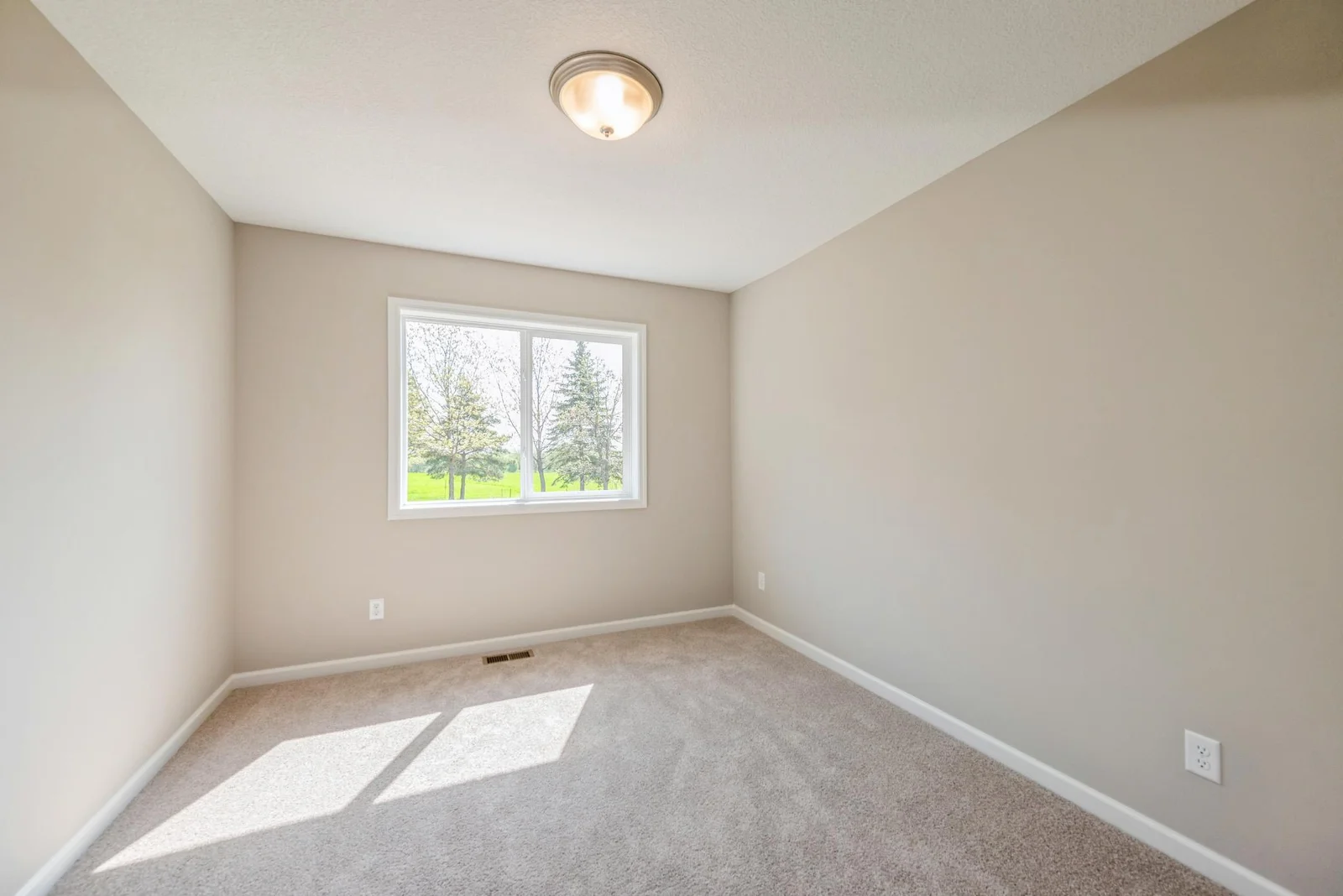 Bedroom 1. Photo is of former model home. See Sales Consultant for Specific Colors and Options. Ability to choose!