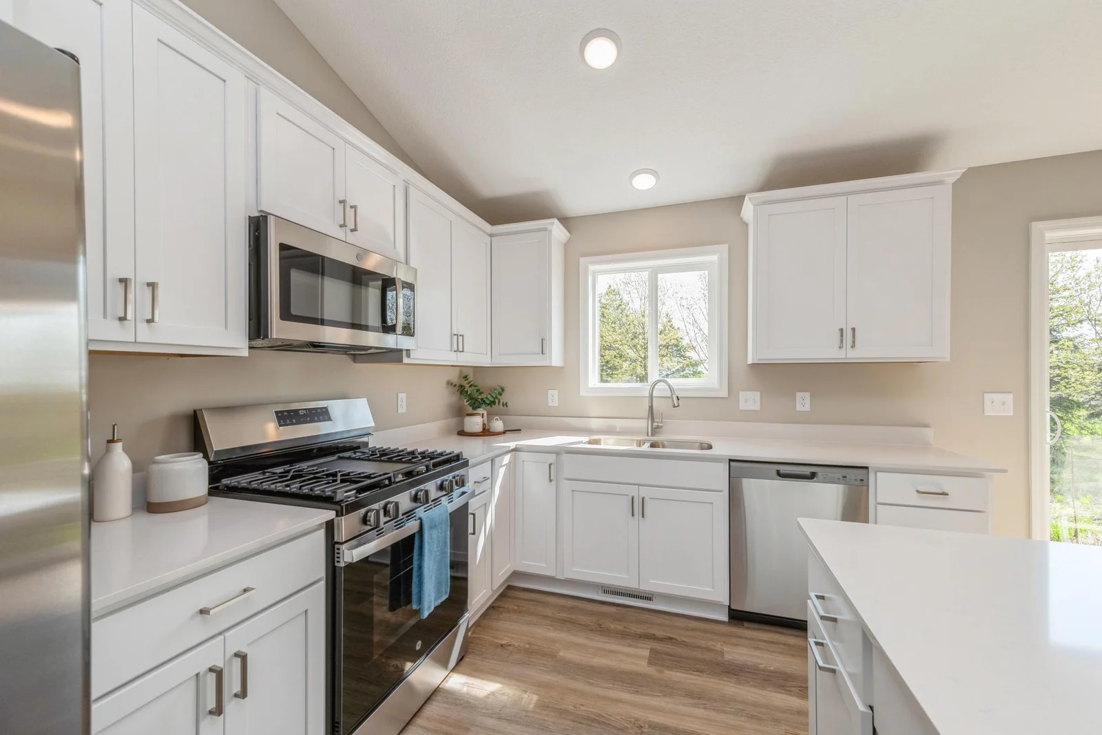 Kitchen View. Photo is of former model home. See Sales Consultant for Specific Colors and Options. Ability to choose!