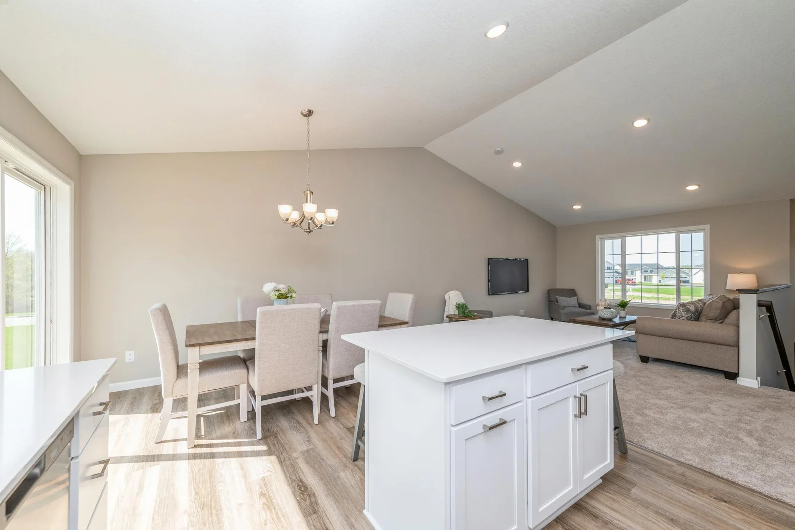 Dining Room - Living Room View.  Photo is of former model home. See Sales Consultant for Specific Colors and Options. Ability to choose!