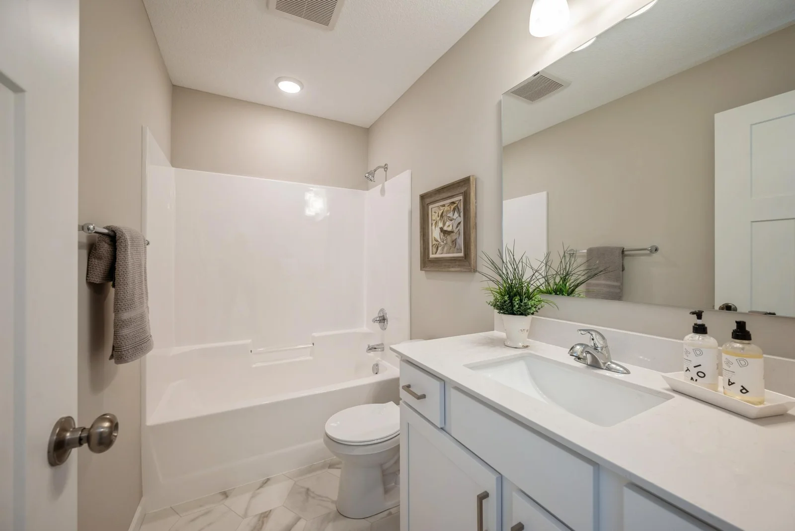 Main Bathroom. Photo is of former model home. See Sales Consultant for Specific Colors and Options. Ability to choose!