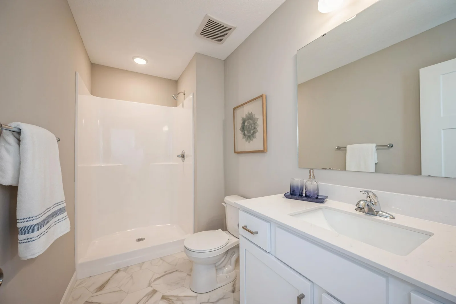 Lower Level Bathroom 3_4. Photo is of former model home. See Sales Consultant for Specific Colors and Options. Ability to choose!