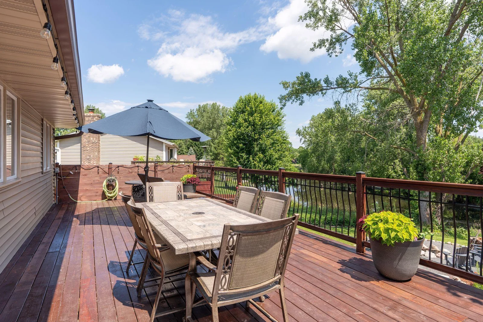 Massive 46+’ cedar deck extends entire length of the home & overlooks a beautifully sculpted backyard w/wood privacy fence, raised garden beds, chicken coop, firepit & peaceful pond, which is part of Evergreen Ponds & connects to Kerry Lake!