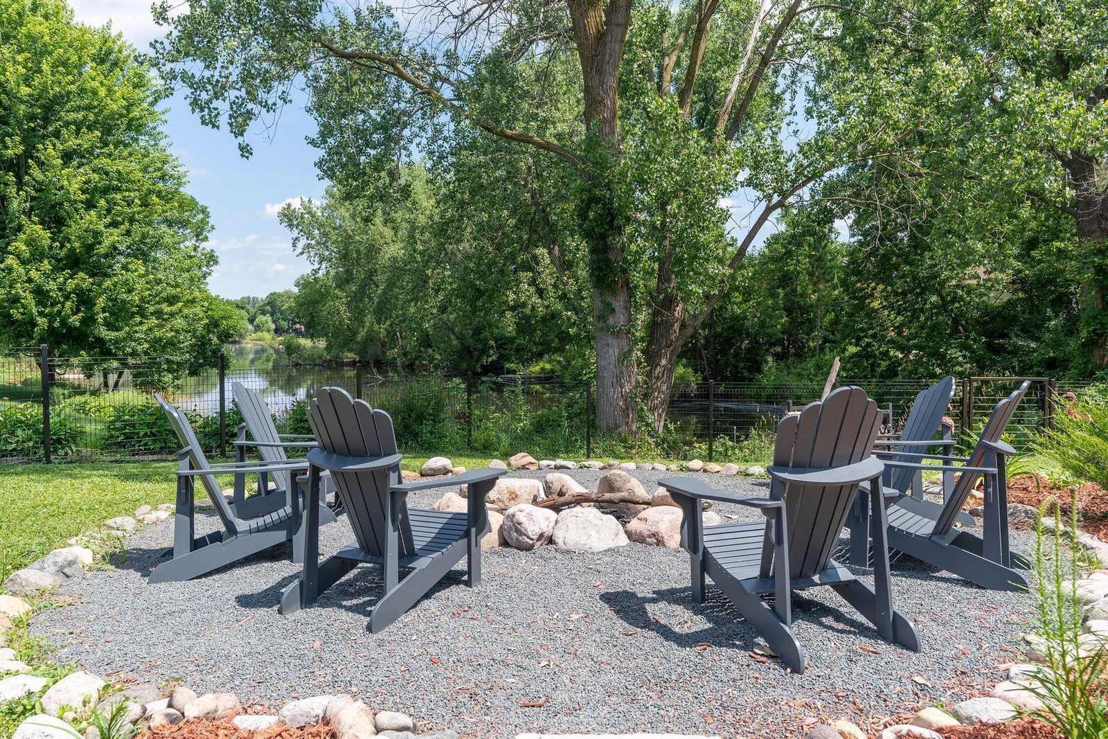 Enjoy peaceful evenings around the fire with breath-taking pond views.