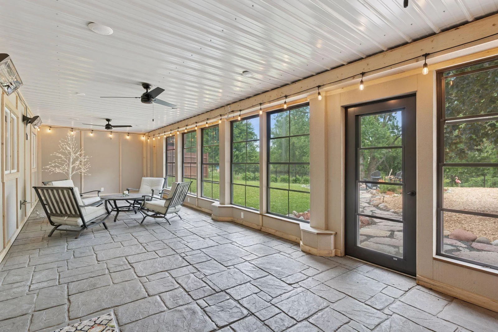 Mammoth 42’ three season porch w/stamped concrete floors, multiple wall-mounted heaters & Amazing EZ-Screen Porch Windows that are puncture resistant and actually stretch but don’t break!