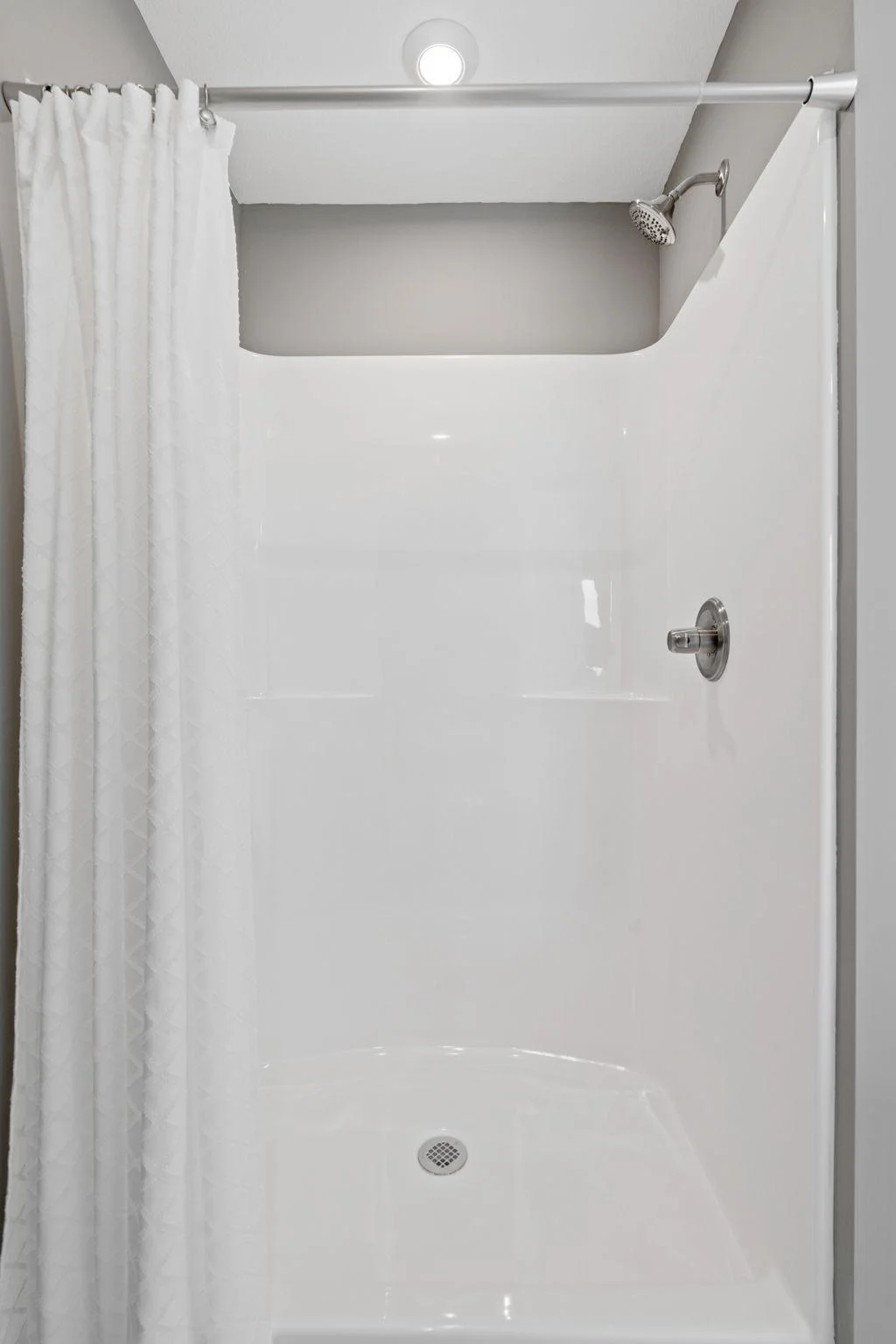 12. Primary Shower. Photo is of former model home. See Sales Consultant for Specific Colors and Options. Ability to choose!