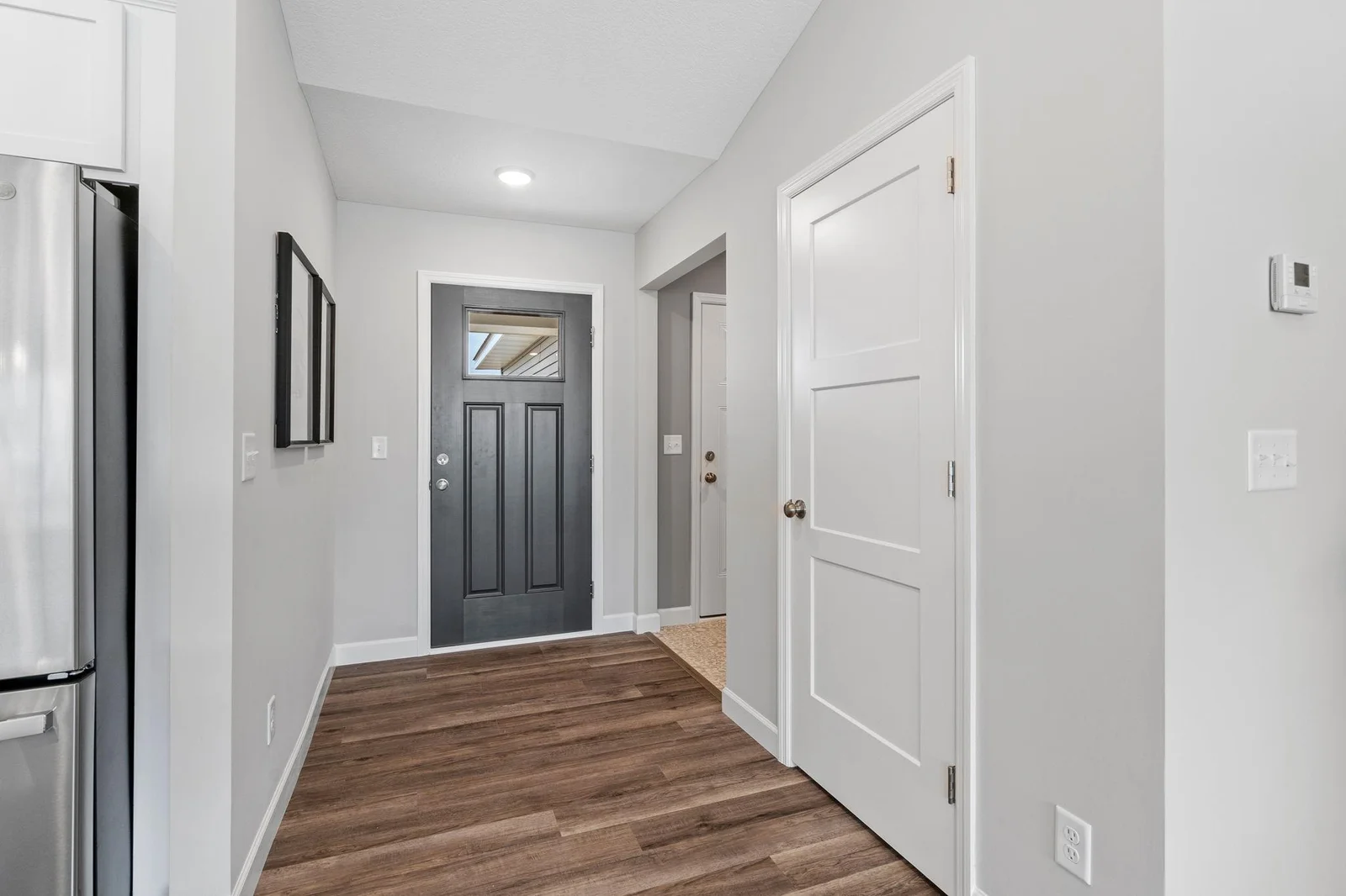 7. Entry. Photo is of former model home. See Sales Consultant for Specific Colors and Options. Ability to choose!