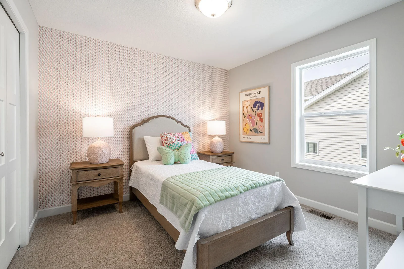 13. Bedroom 2. Photo is of former model home. See Sales Consultant for Specific Colors and Options. Ability to choose!