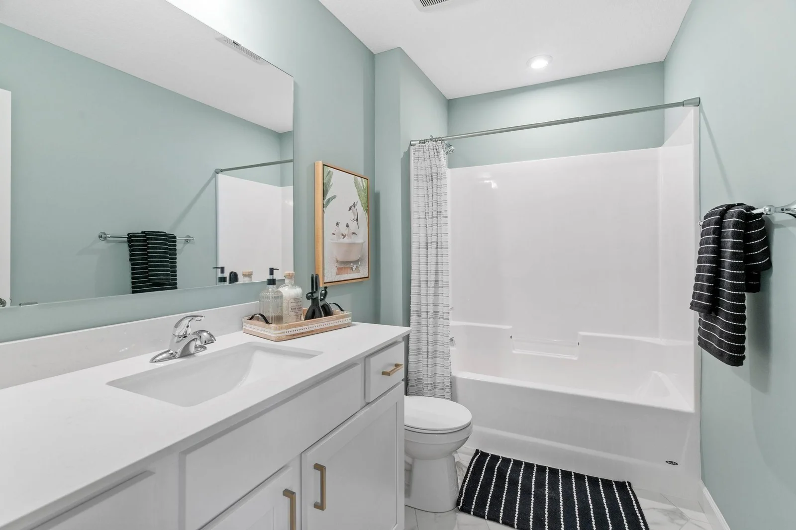 15. Main Bathroom. Photo is of former model home. See Sales Consultant for Specific Colors and Options. Ability to choose!