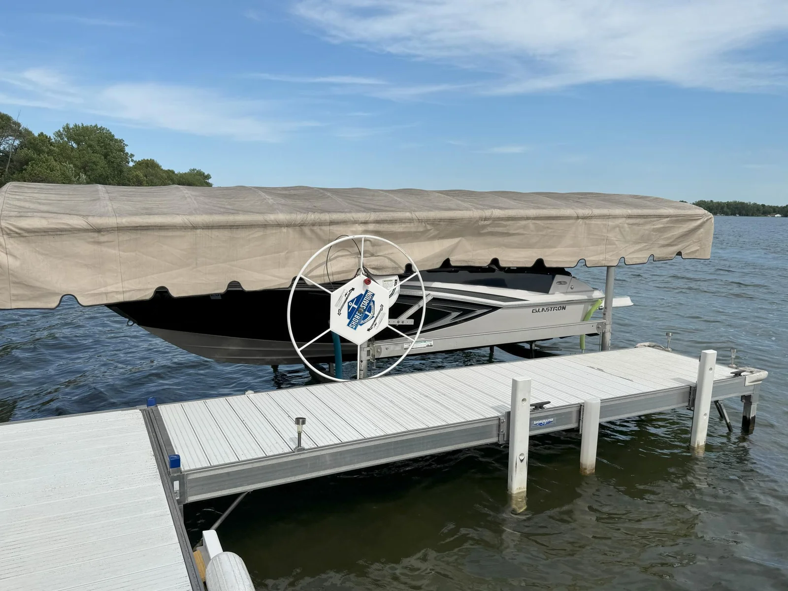 23-Glastron boat and motor, lift, and trailer included (1).jpg