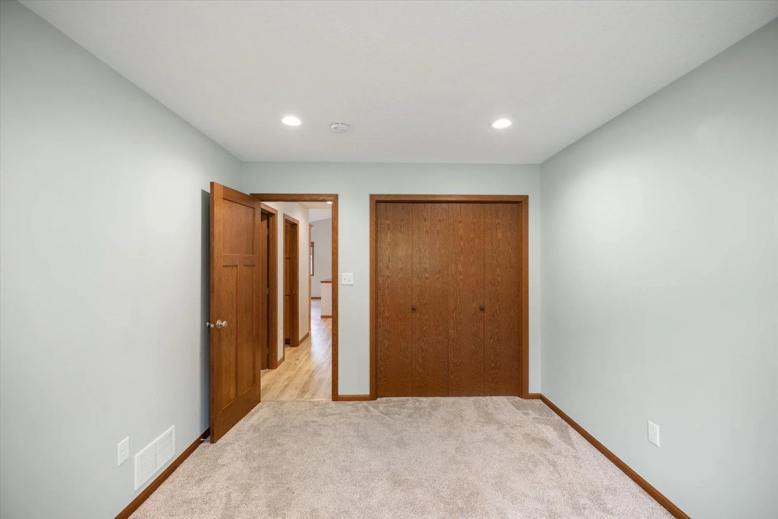 Another view of Bedroom #2 with a large closet. The closets in both bedrooms in the main level has a light.