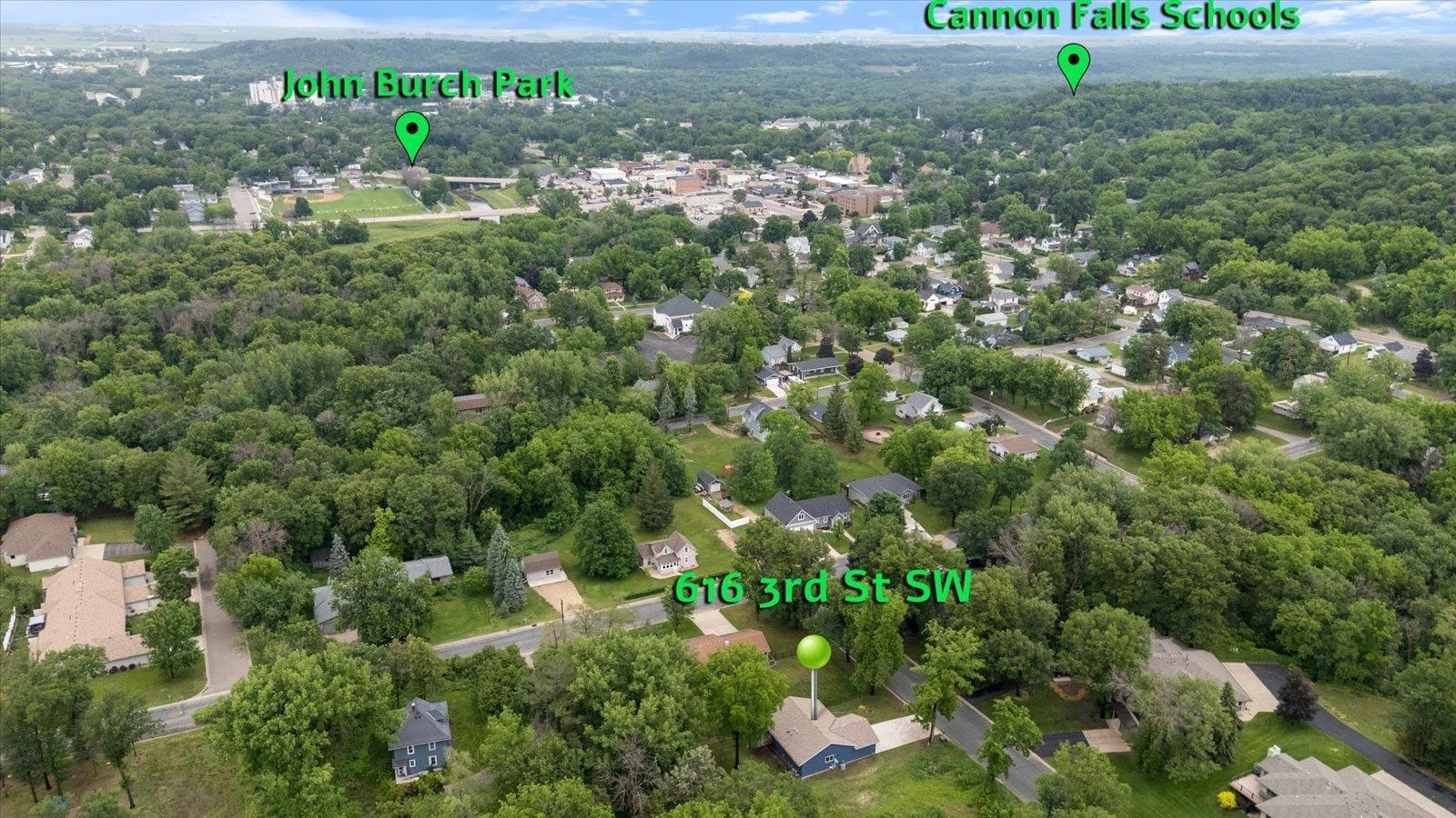 Another drone shot of the home in relation to Cannon Falls Schools and John Burch Park.