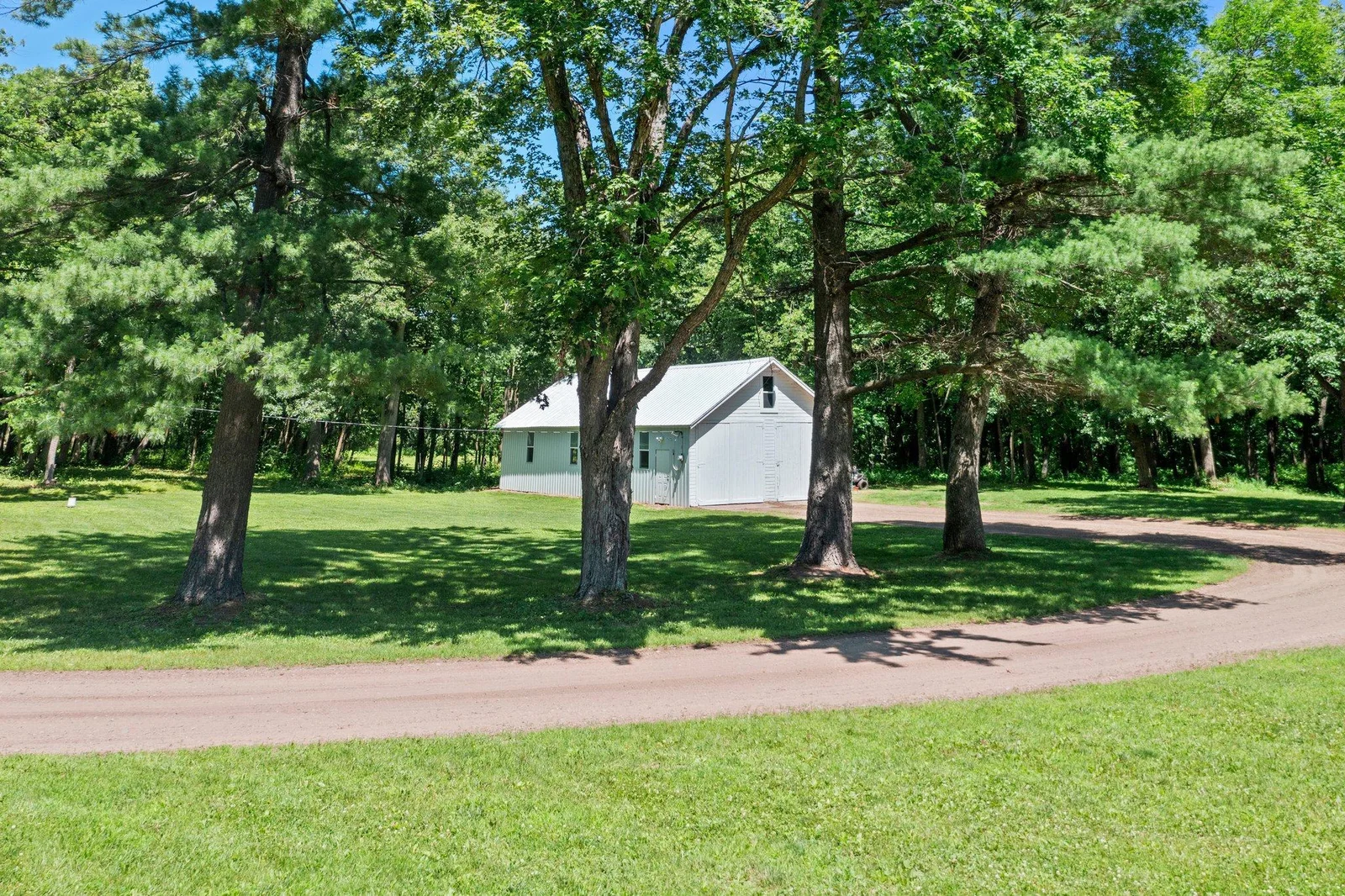 A pole shed set up for storage as you get ready to build your dreams on this property.