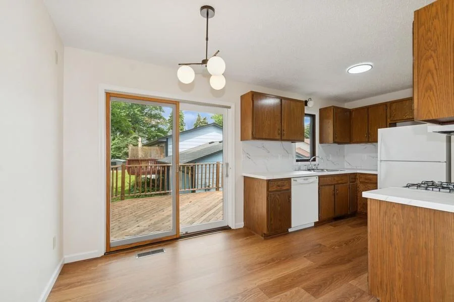 Update light fixtures and flooring in the kitchen