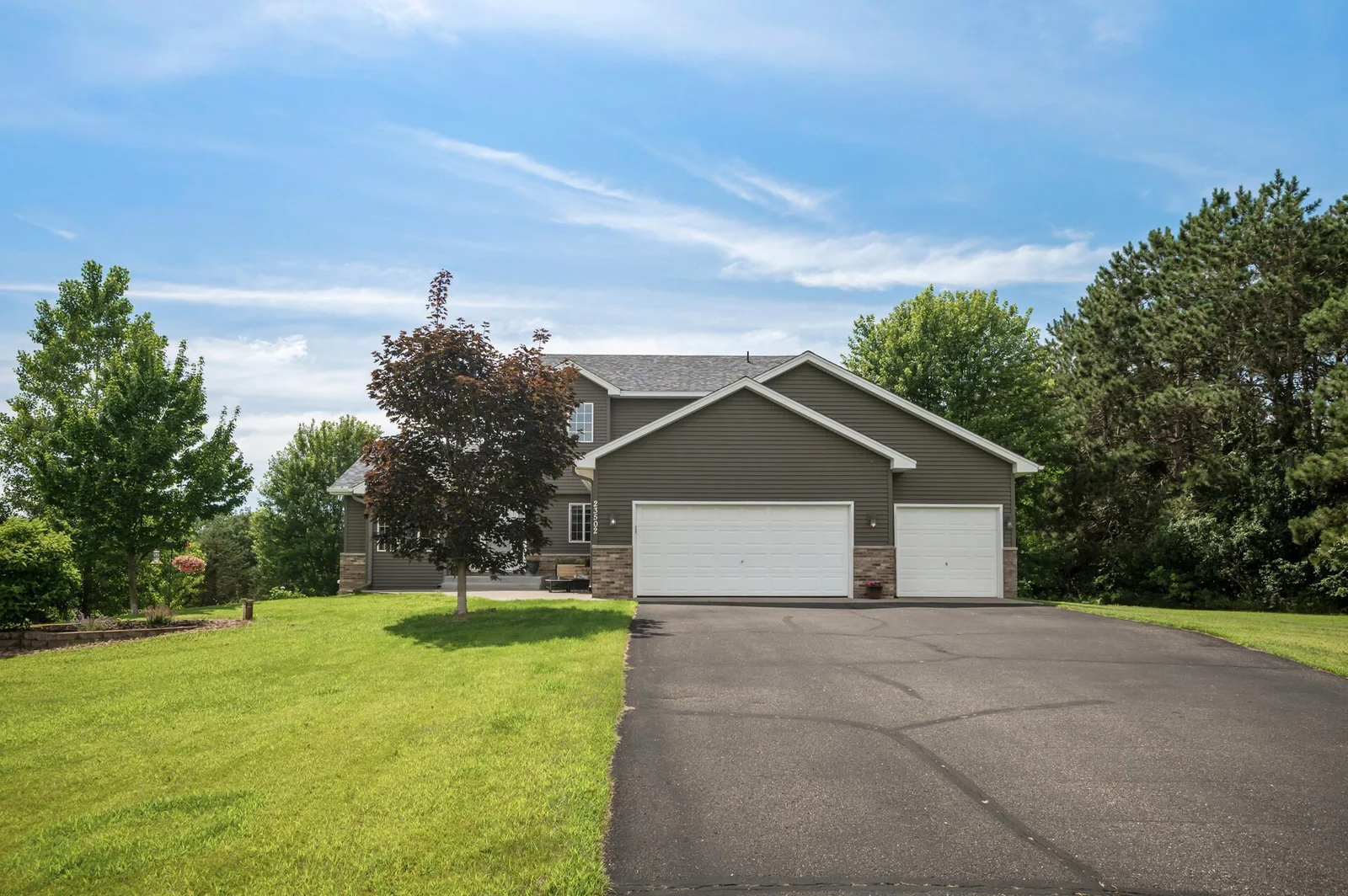 Great 3 car garage with plenty of parking space in the driveway.