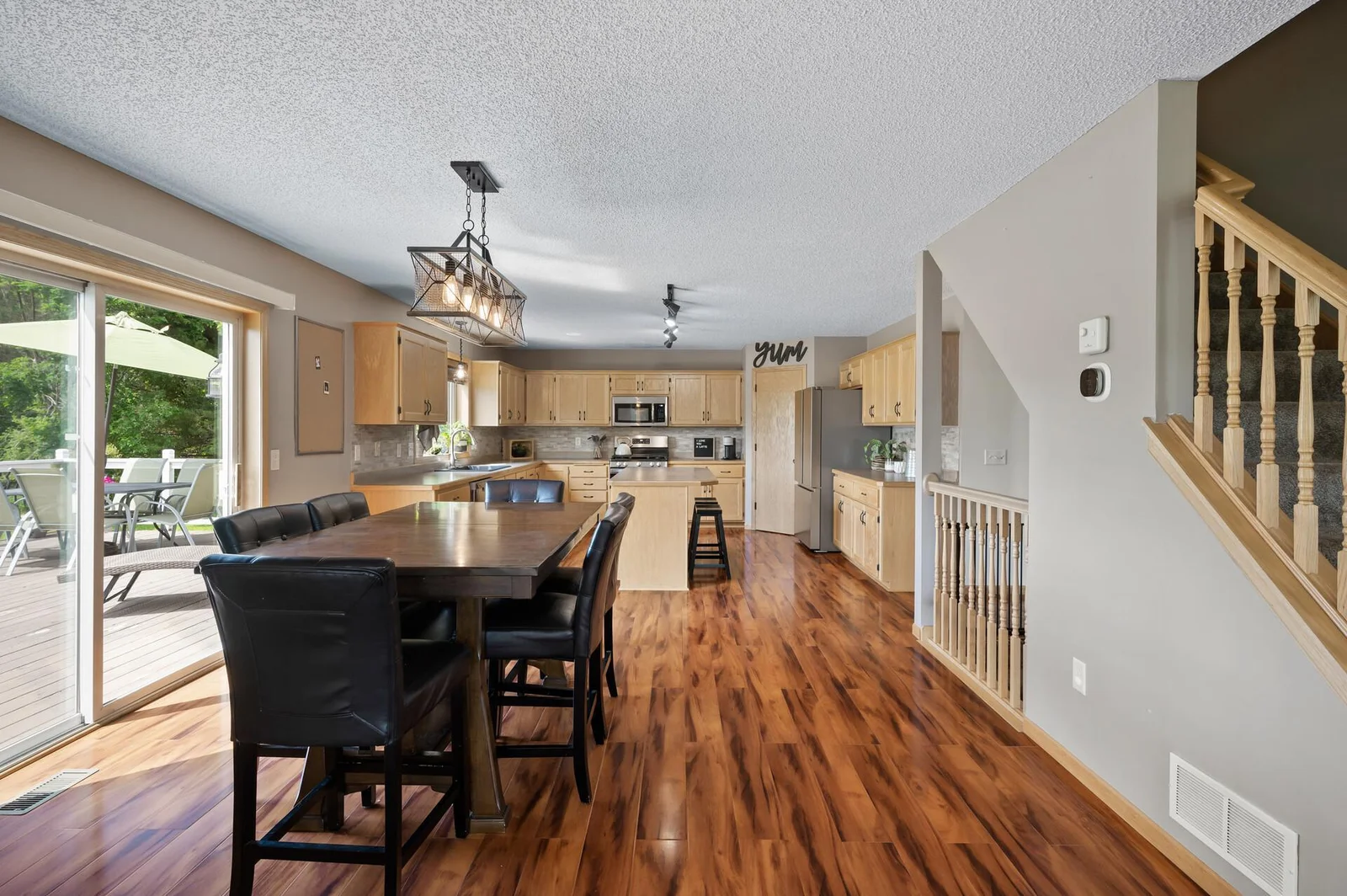 New lighting, tigerwood floors and patio door that opens up to a HUGE deck.