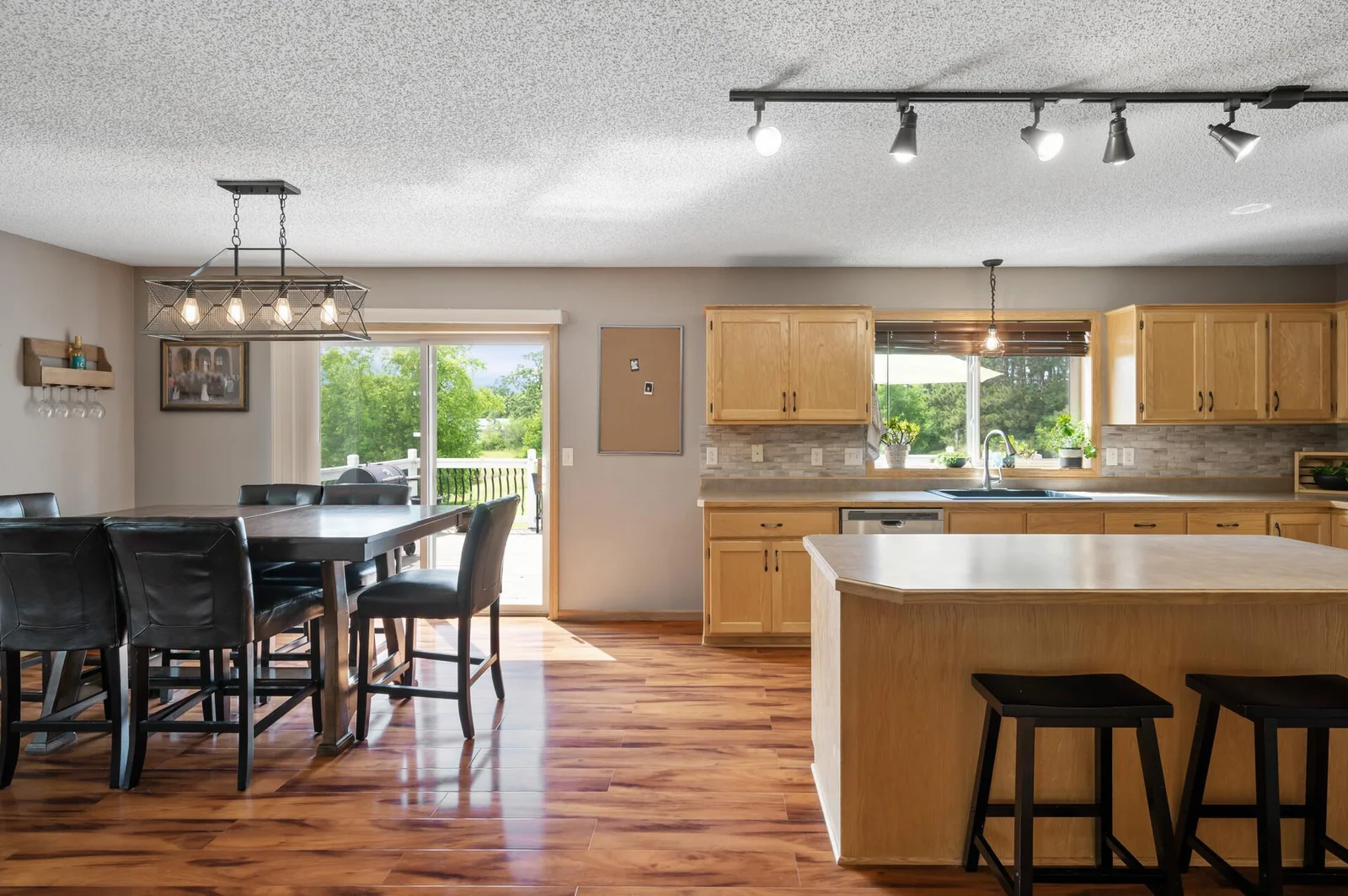 Spacious kitchen with large center island and ample cabinetry.