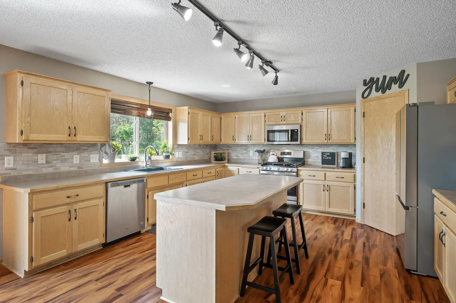 Nice big window above the sink that overlooks the backyard.