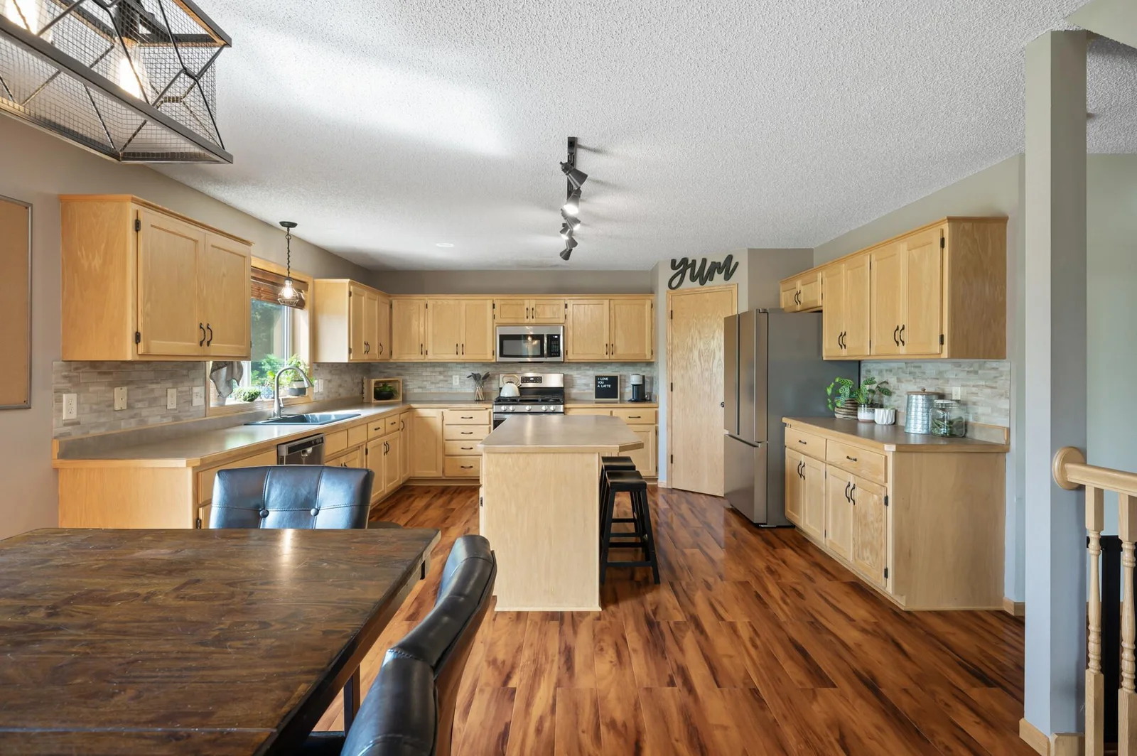 Newer stainless-steel appliances and walk-in pantry closet.