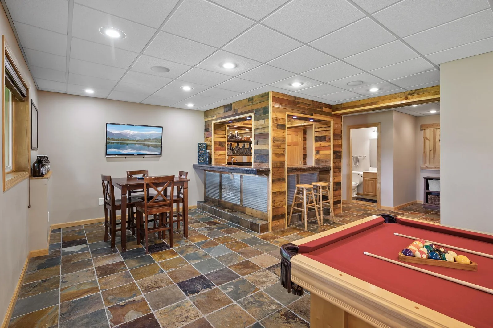 Full wet bar and beautiful slate flooring!