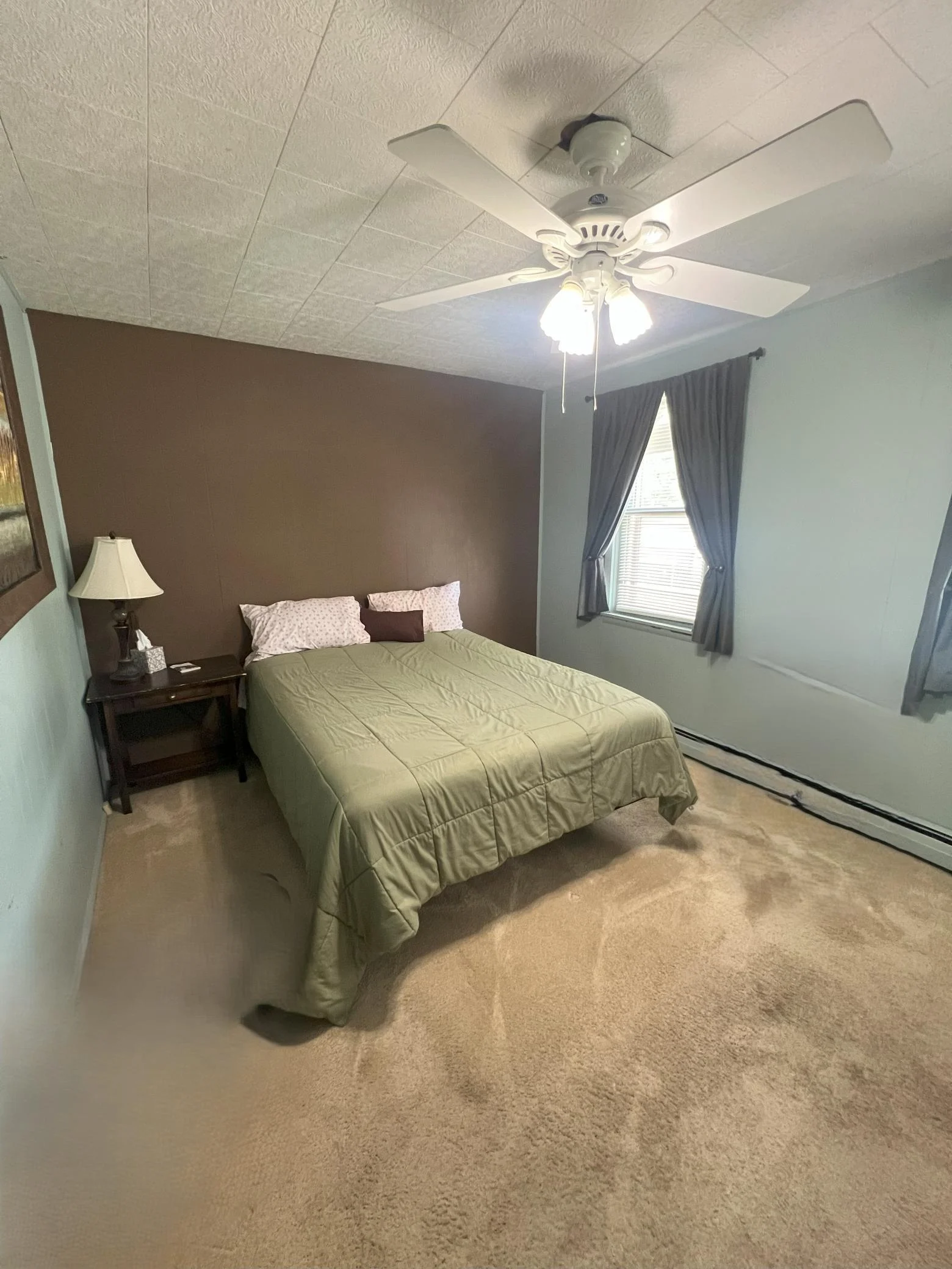 Main Floor Primary Bedroom with Ceiling Fan.jpg