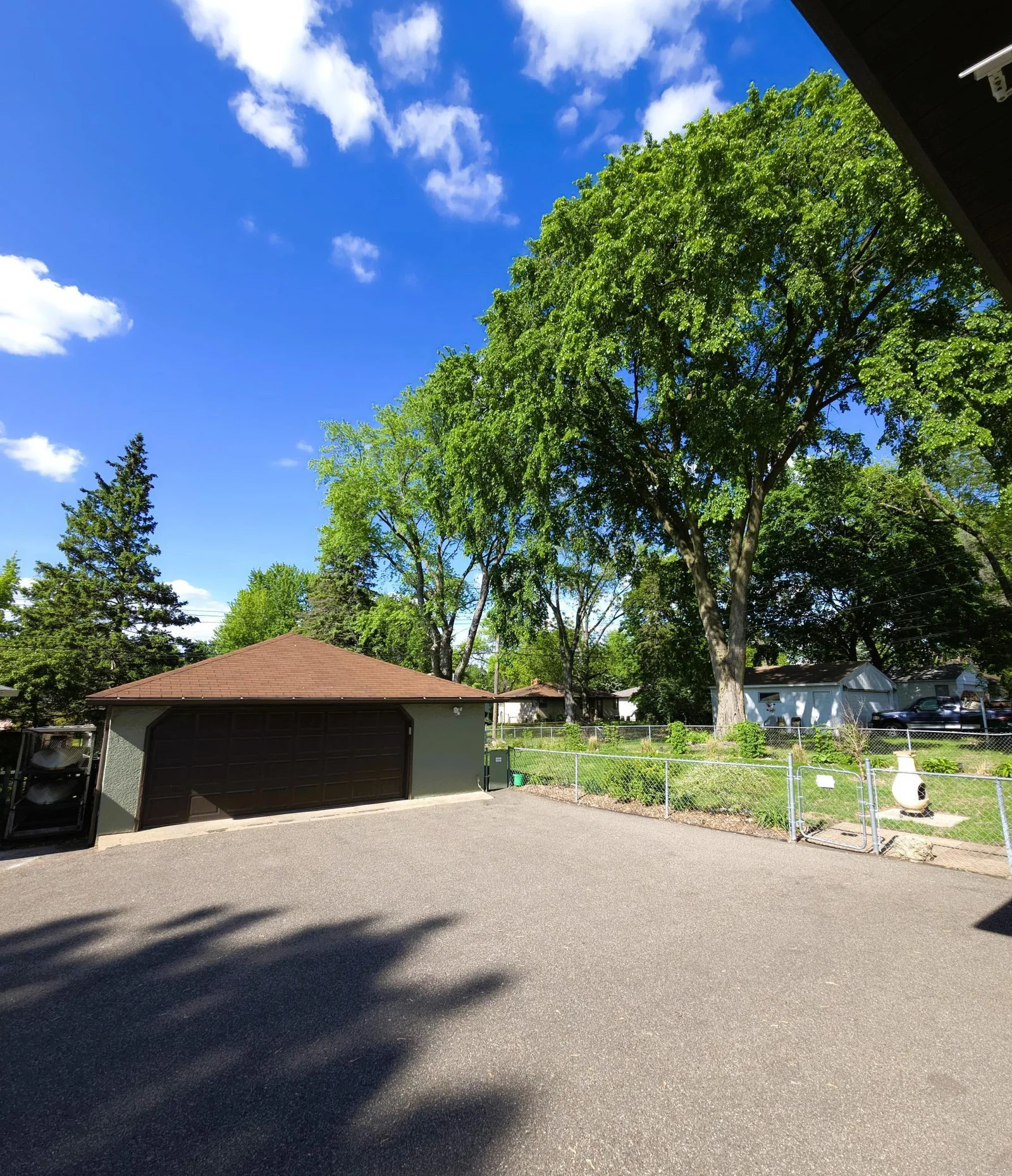 719 back corner of house facing garage.jpg