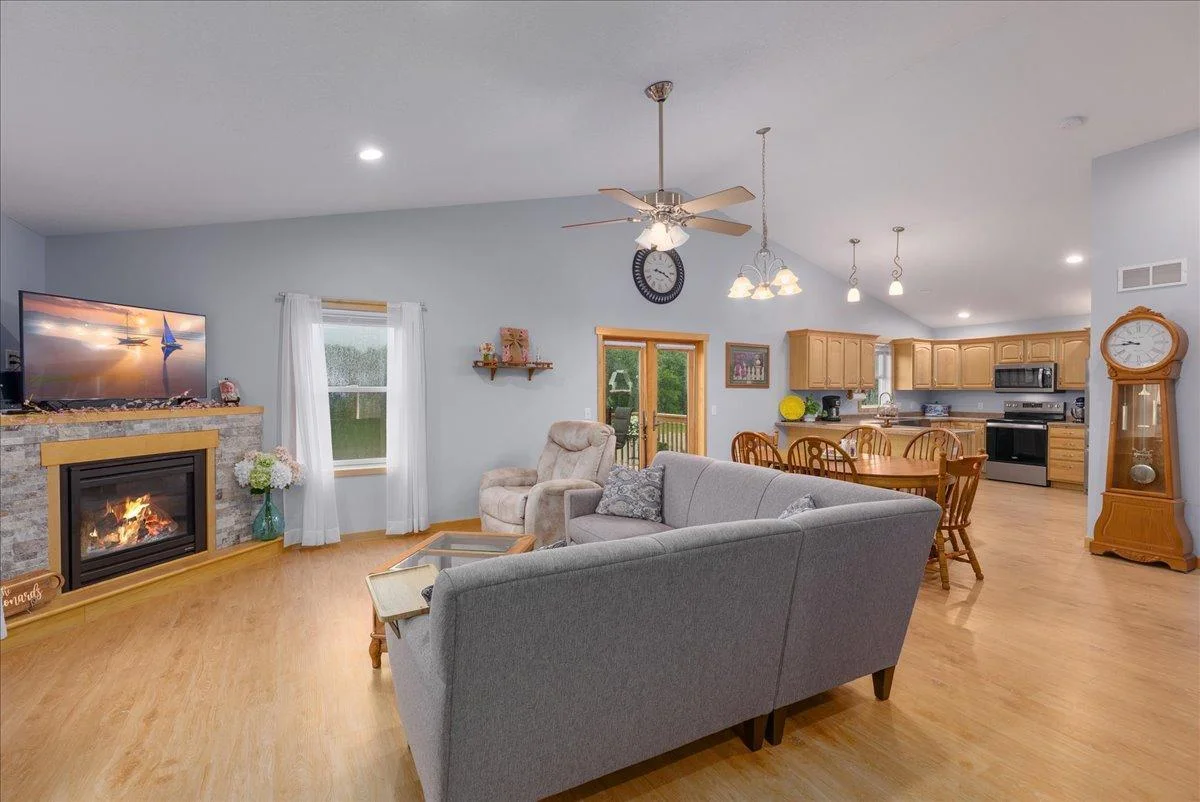 Enjoy this open floor plan living with all new LVT flooring  and snuggle in to the gas fireplace while watching your favorite show