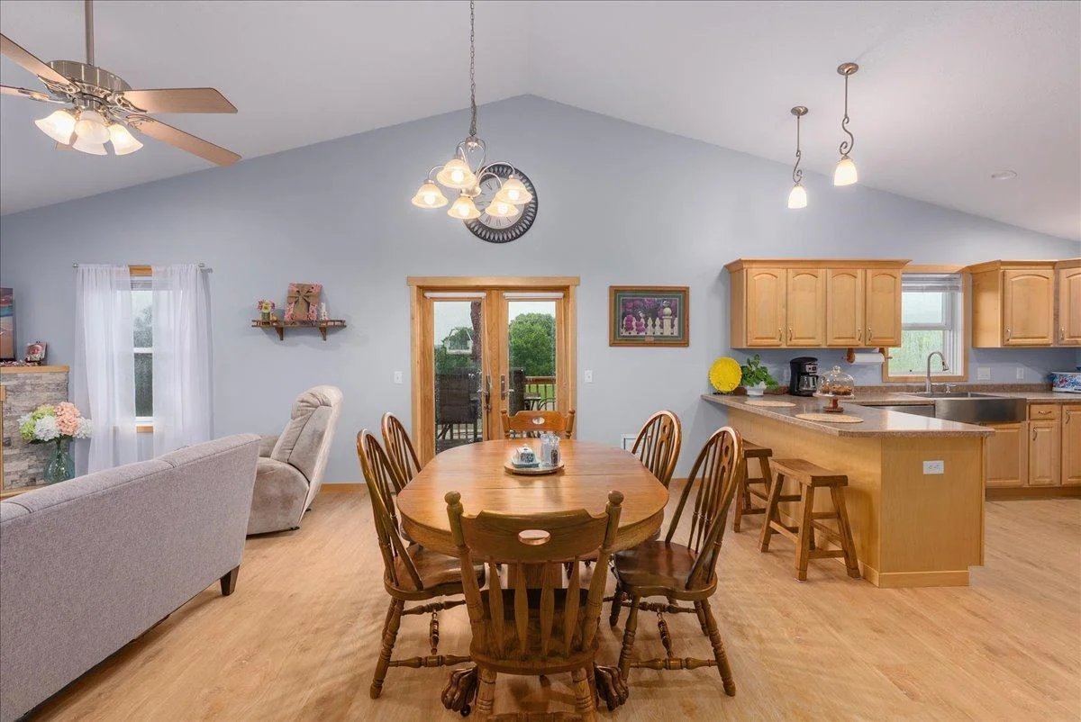Eat in kitchen/dining that walks out to the beautiful deck overlooking the gorgeous fenced in back yard