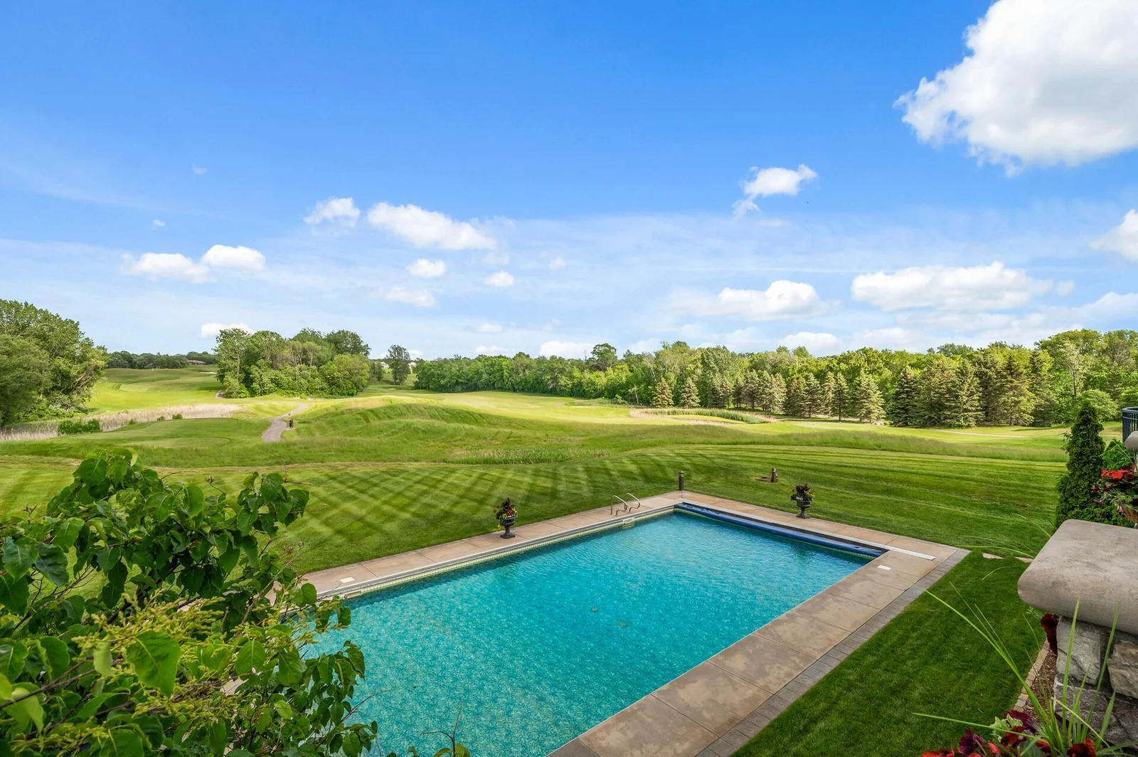 Wake up to this breathtaking view every day! Enjoy your morning coffee overlooking the sparkling pool and the lush greens of the golf course.