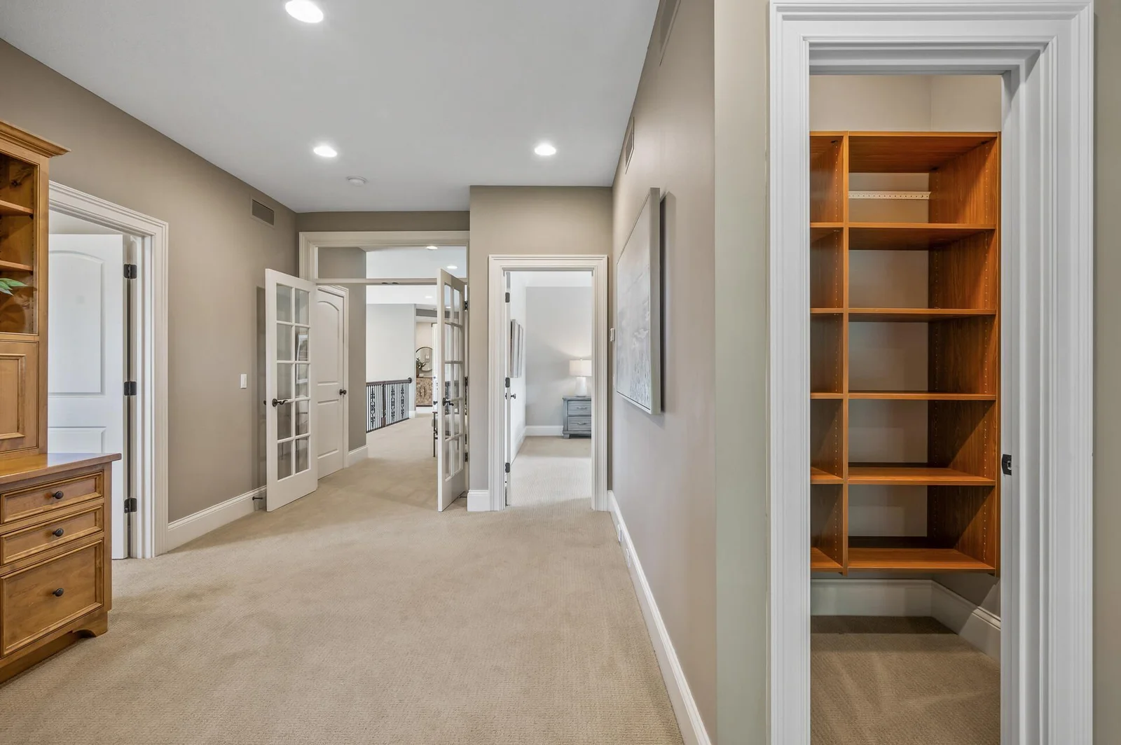 Expansive upper level hallway offering easy access to the bedrooms and loft area.