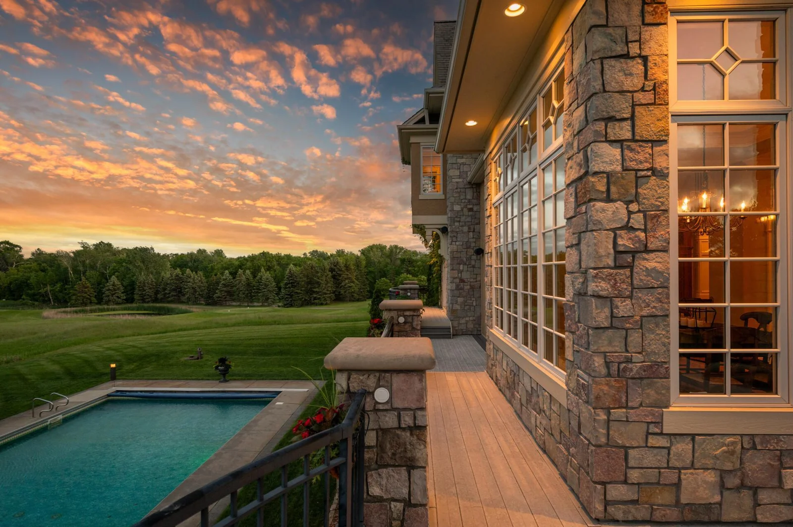 Experience the ultimate blend of luxury and the outdoors as you enjoy the twilight views of your pool and the golf course from your upper deck.