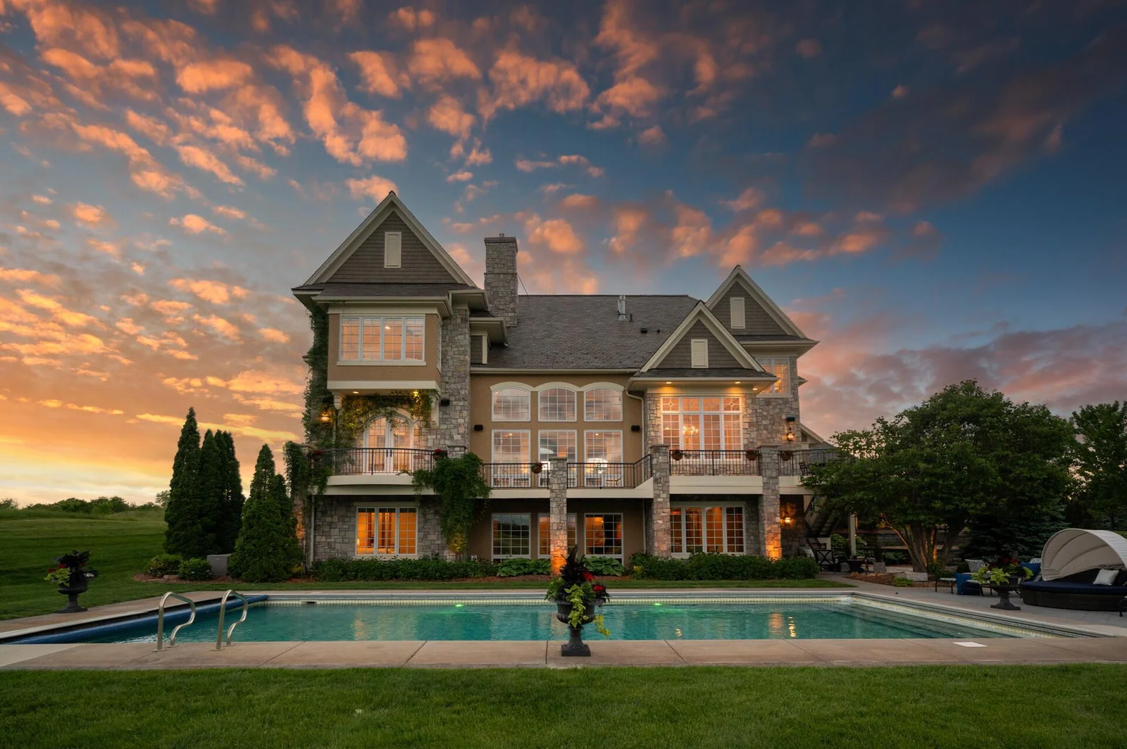 As day transitions to night, the beauty of your backyard oasis is illuminated.
