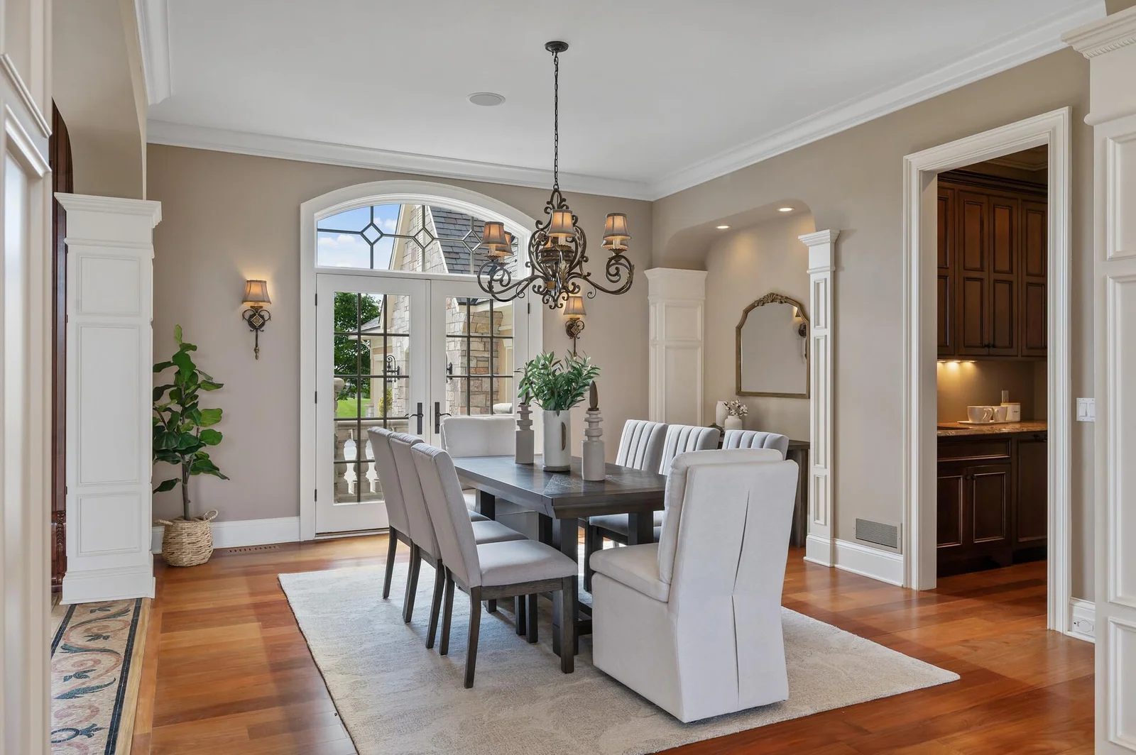 Enjoy easy access to the outdoors from the charming dining room, featuring beautiful French doors that open to the front porch.