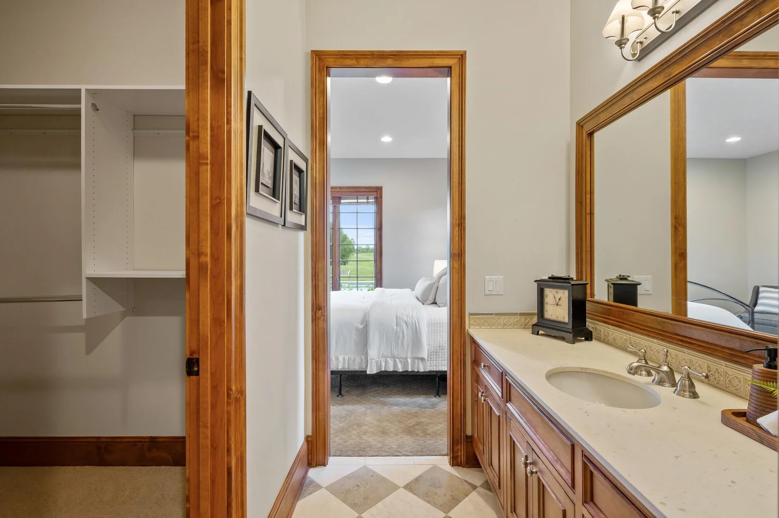 The well-appointed layout of the lower level includes this bedroom with a Jack-and-Jill bathroom.