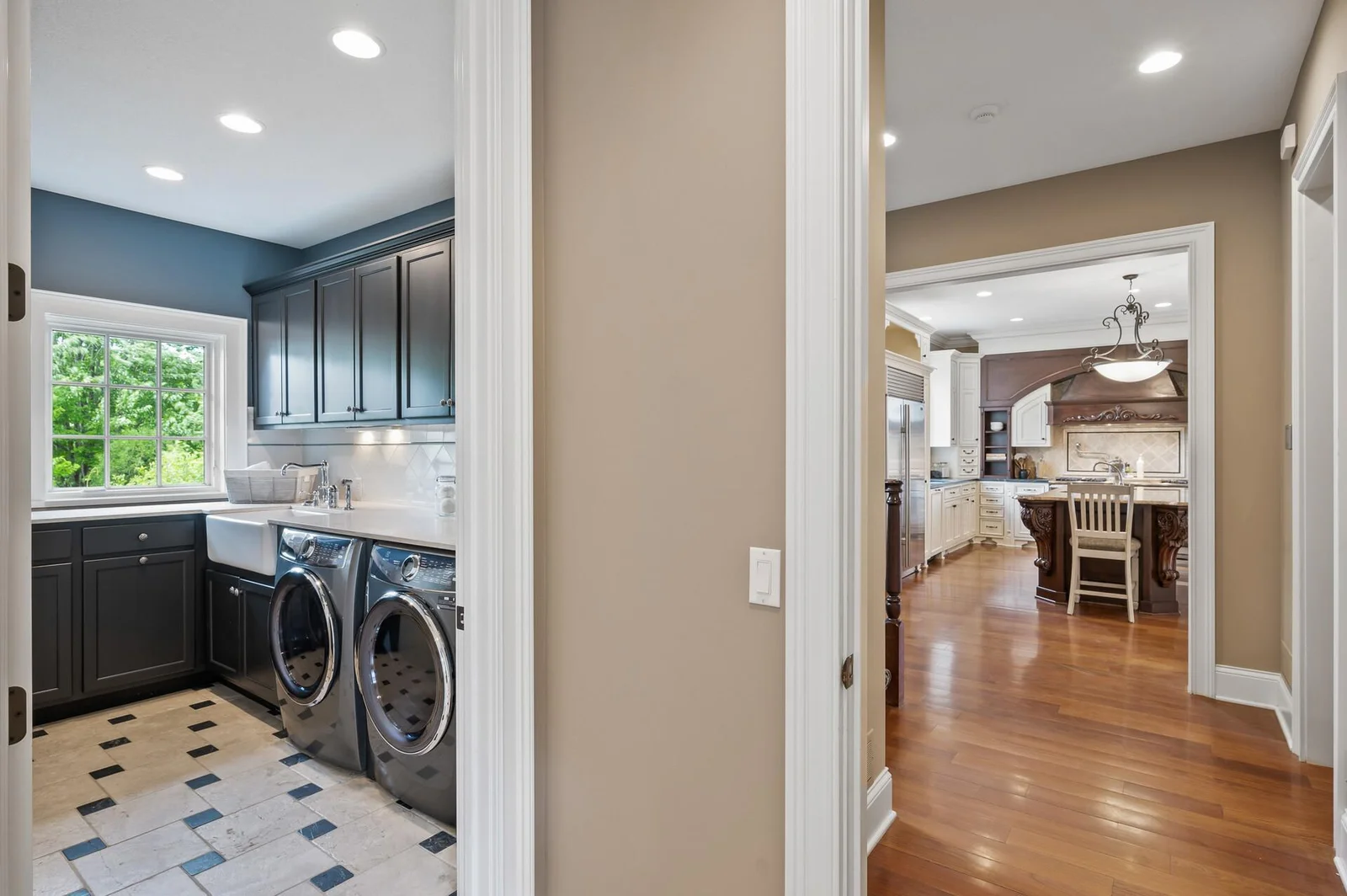 Practical laundry room just steps away from the beautifully appointed kitchen.